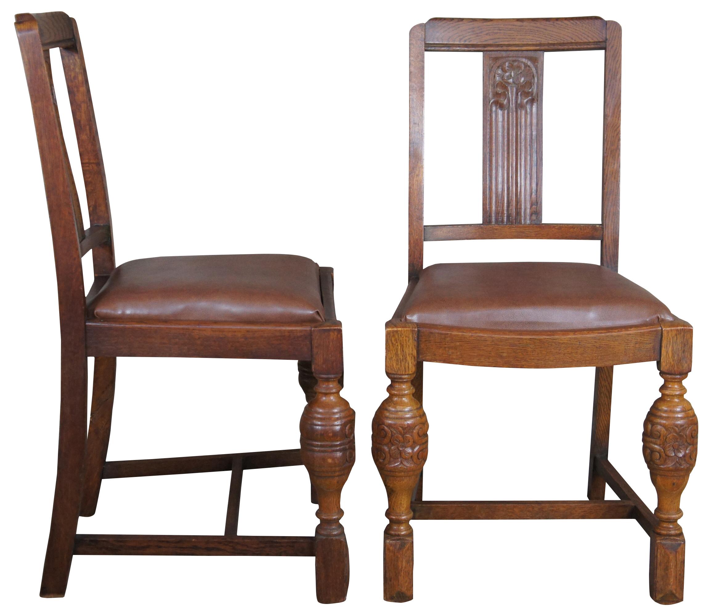 A lovely pair of 1930s Elizabethan revival dining side chairs by Jacob Summers & Sons. Part of their Hillcrest Suite as seen on page 18 of their catalog.  Made from oak with a flower carved back, leather saddle seat and robust baluster shaped from