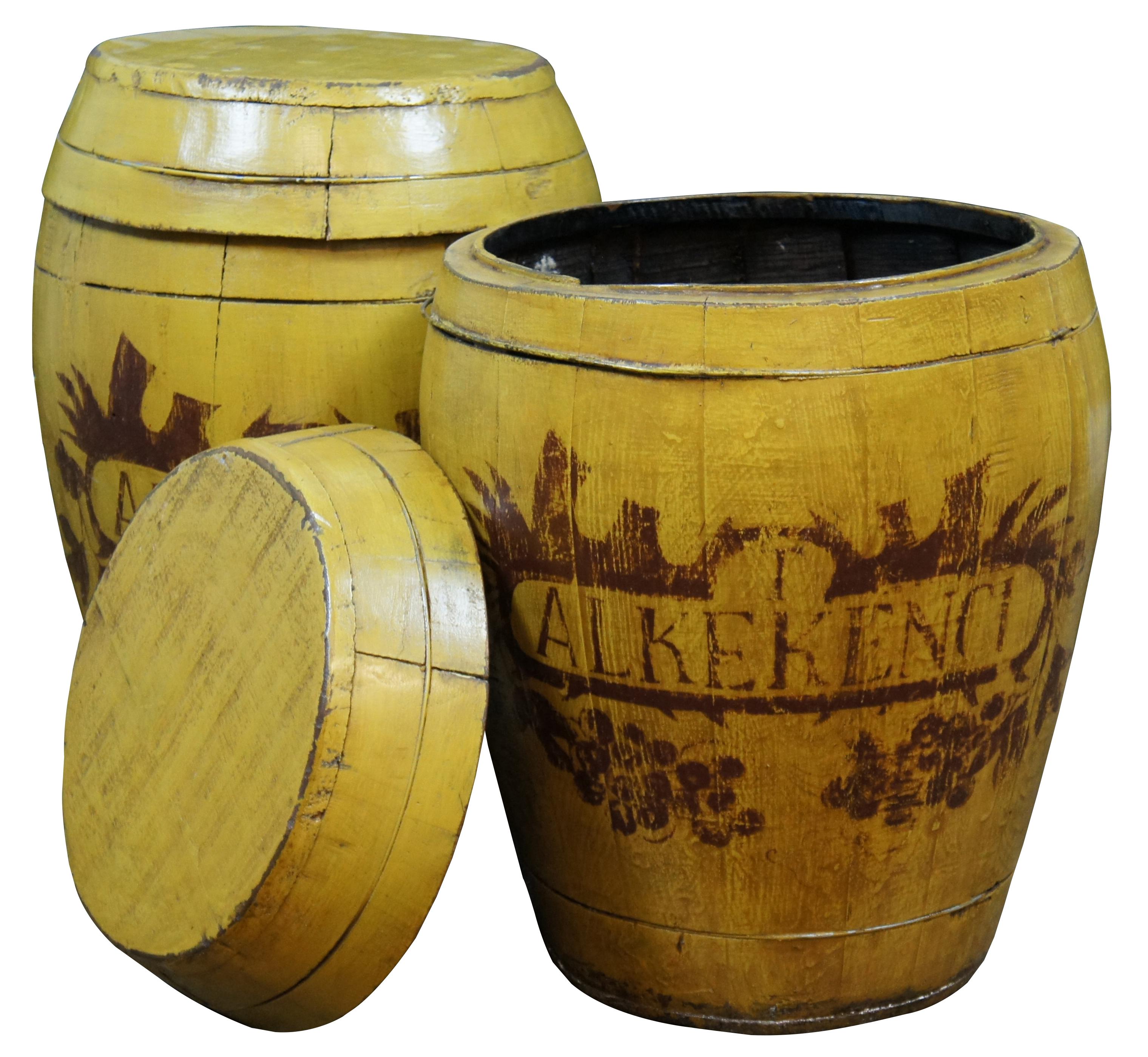 Antique wooden barrel shaped containers / jars / end tables or stands painted yellow and stenciled with the word Alkekenci (alkekengi – the winter cherry / strawberry groundcherry) surrounded by a grape vine. Size: 18