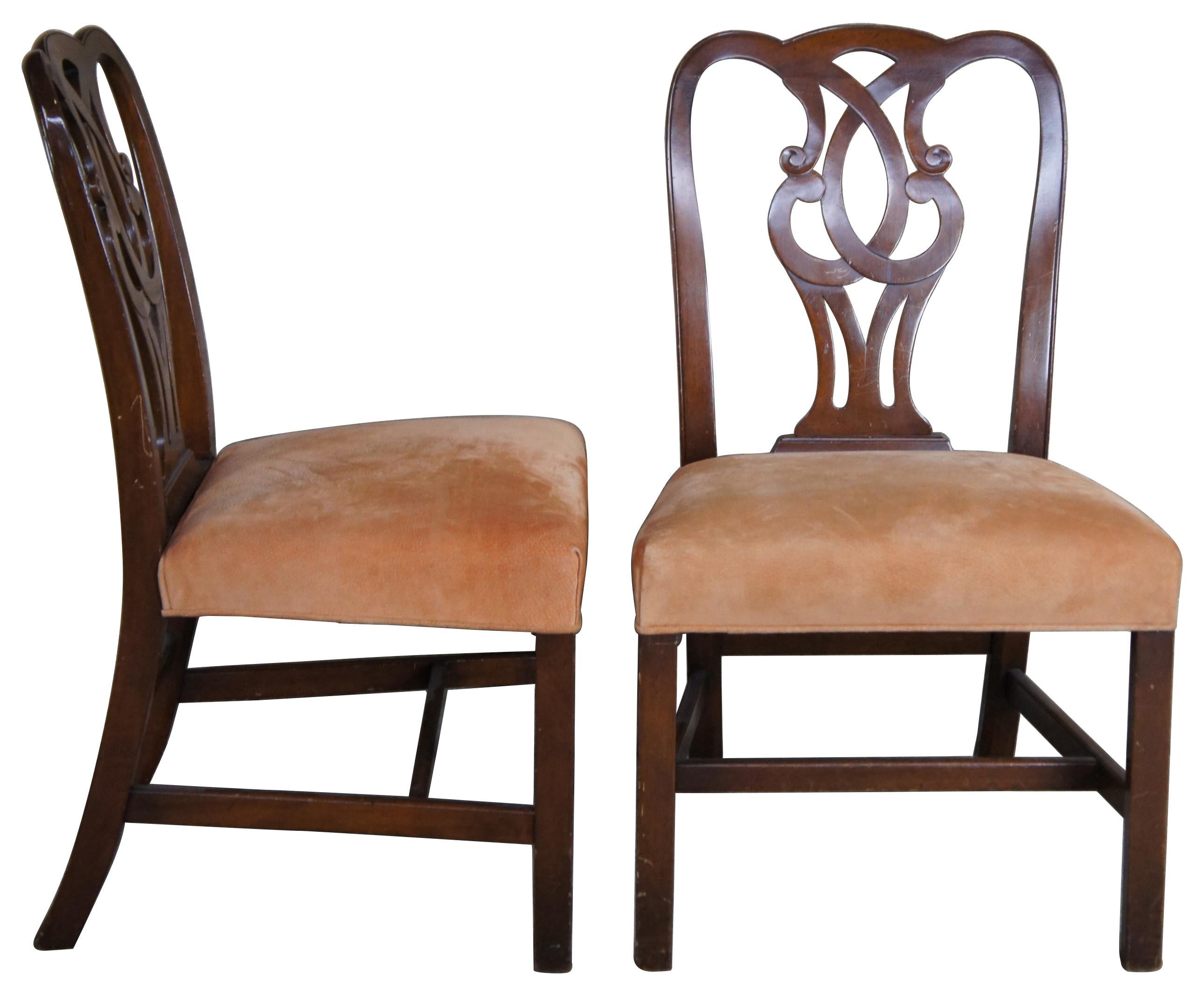 Two antique Chippendale style side chairs. Made of mahogany, featuring a pretzel back and peach uphosltered seat. Measure: 37