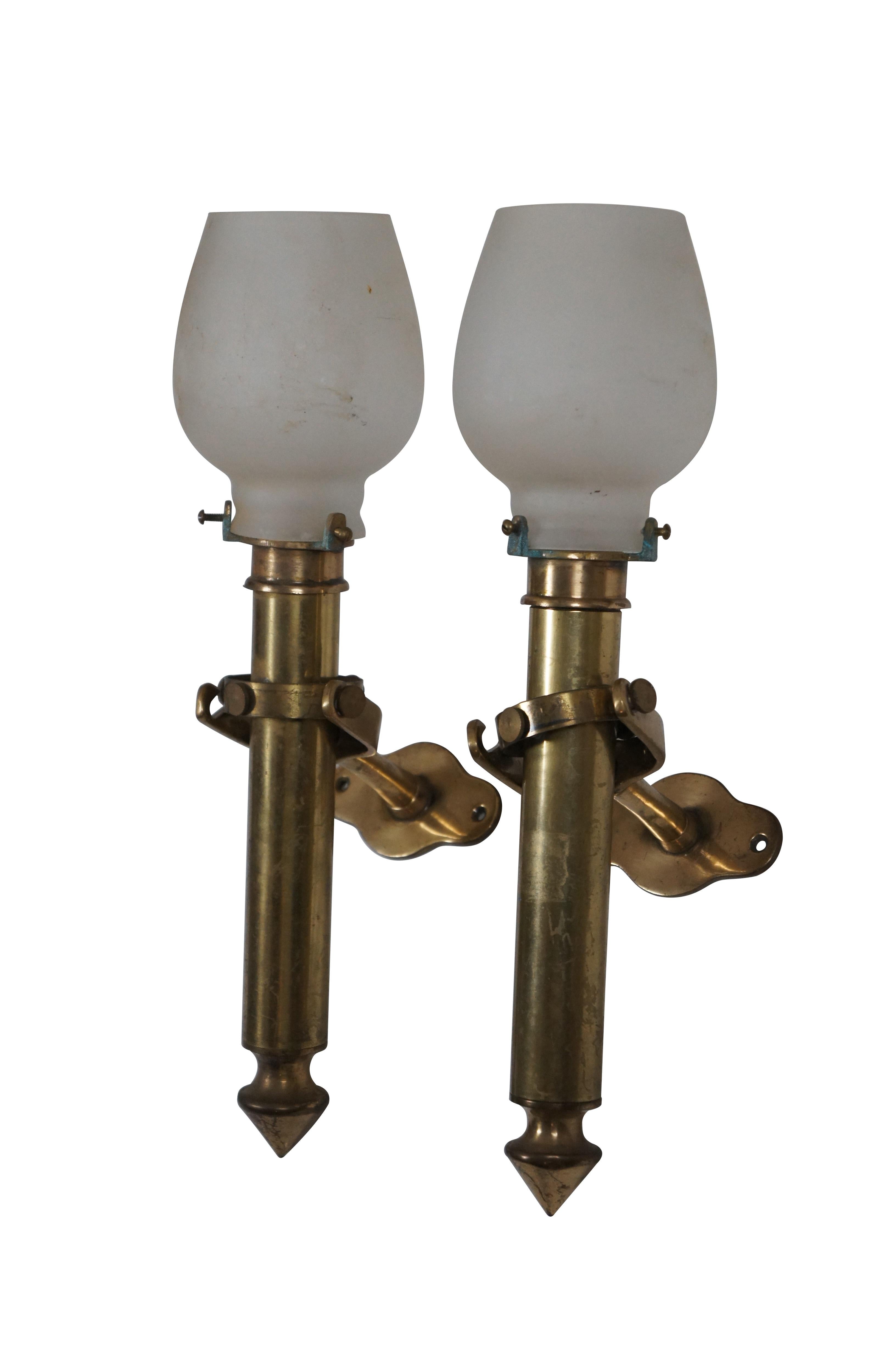 Pair of 19th century brass nautical / maritime / marine / railway / sailing ship's swiveling / gimbal wall sconce pair. Simple column design with pointed / weighted bases that can be removed from bracket for use and a handheld torchiere light.