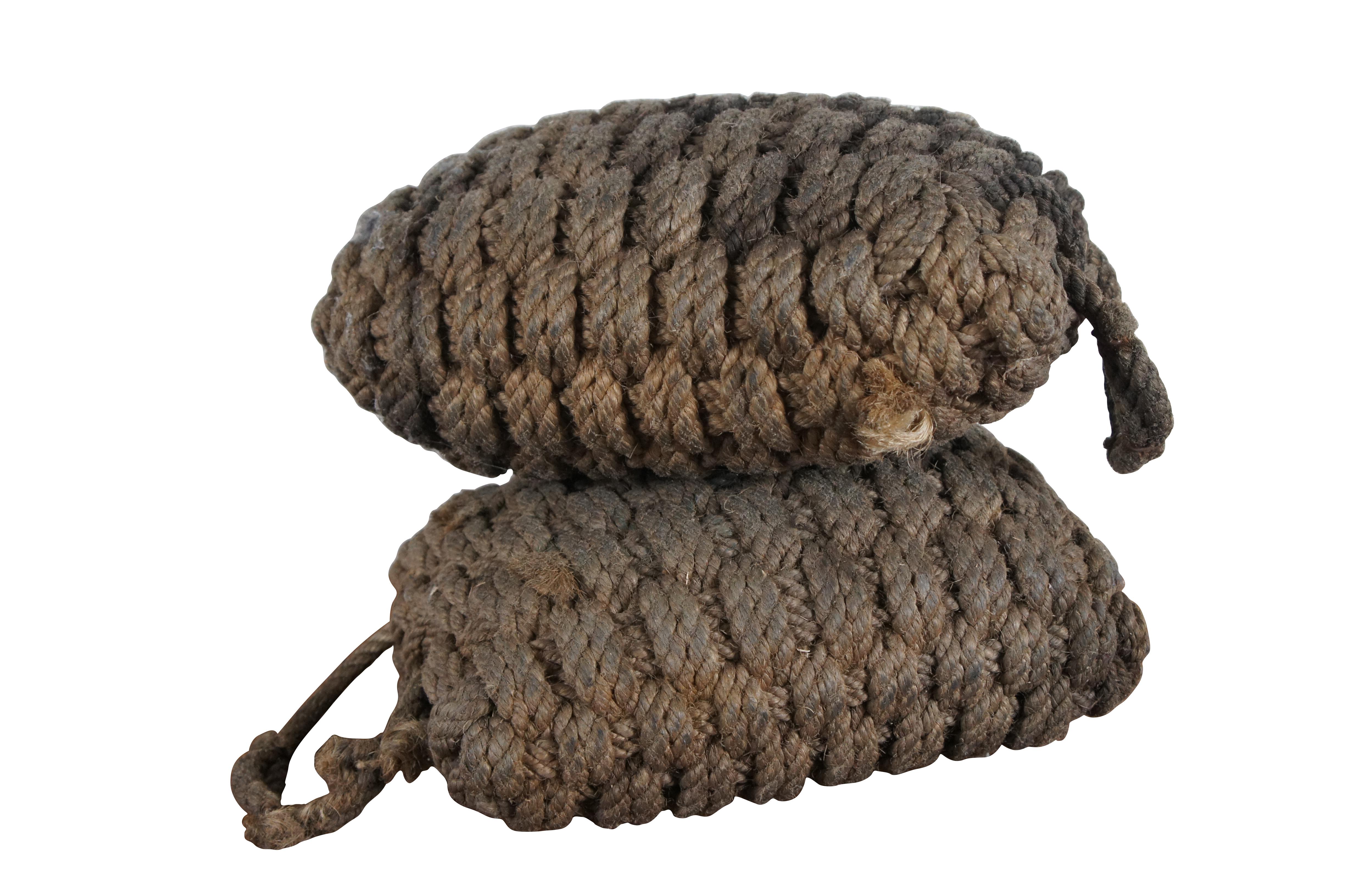 Pair of early 20th century boat bumpers / fenders, rectagnular shape woven from natural hemp rope with handle.

Dimensions:
13