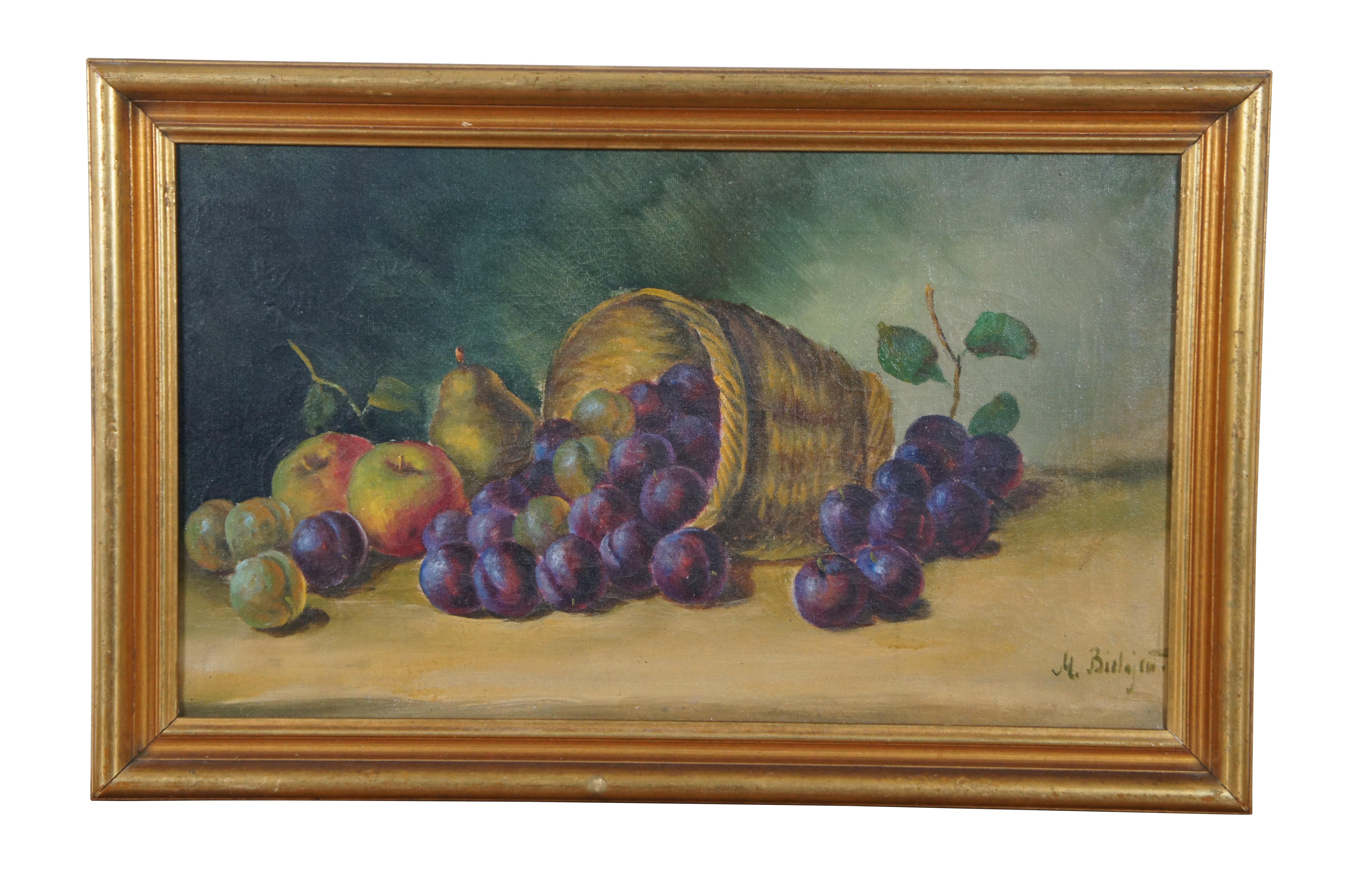 Pair of antique oil on canvas still life paintings showing a a variety of fruits. Signed in lower left by artist (possibly M. Bielajein?), with additional notations on the reverse of the canvas. Measures: 21.5