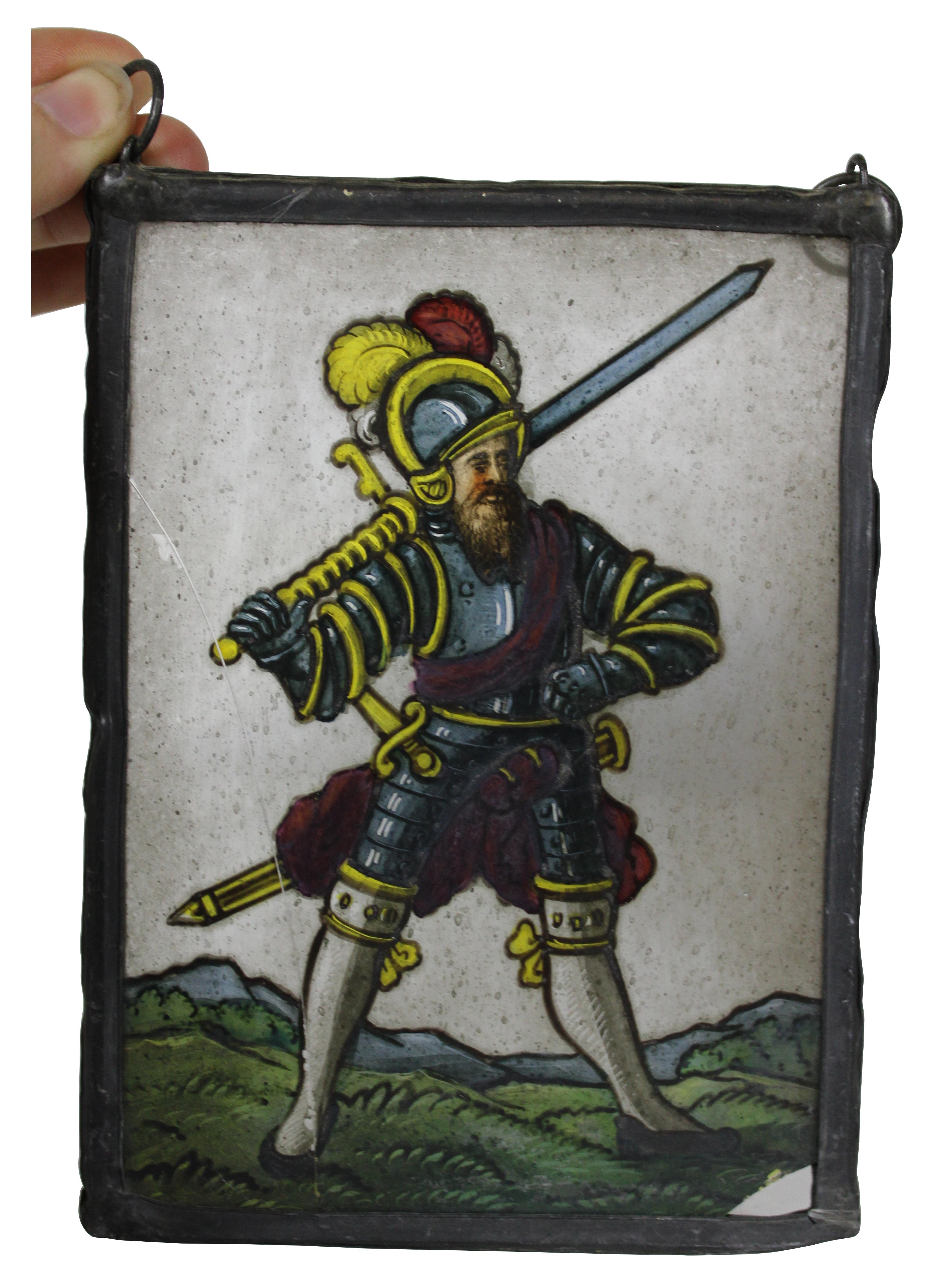Pair of antique reverse painted glass panels in leaded frames, showing a fully armored knight with a greatsword on his shoulder and a well dressed man in blue, holding what could be a halberd.
 