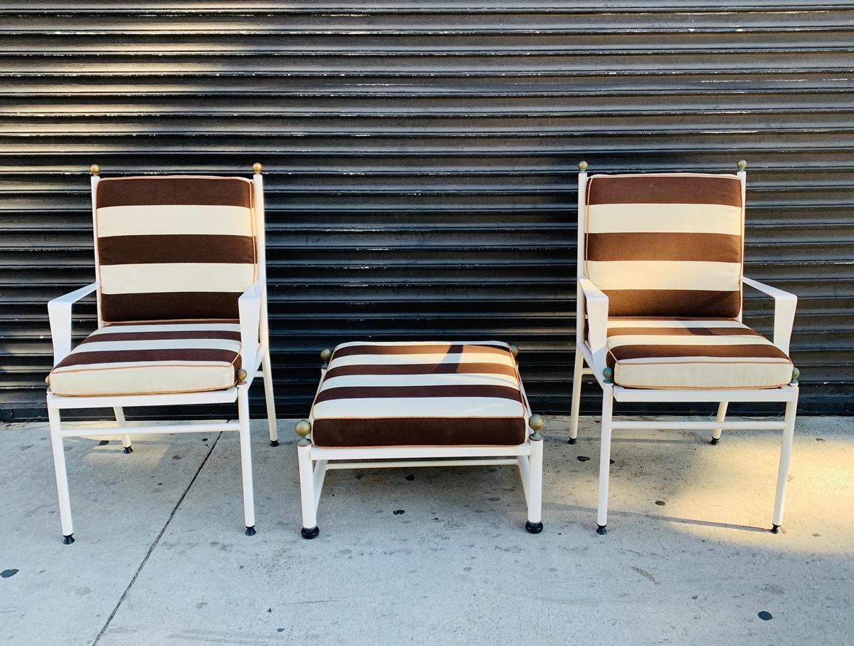 Beautiful pair of armchairs and ottoman designed and manufactured in Spain by Hugonet.
The pieces are made in tubular aluminum and finished in white enamel.
The chairs and ottoman have brass accents and beautiful architectural lines.
These are