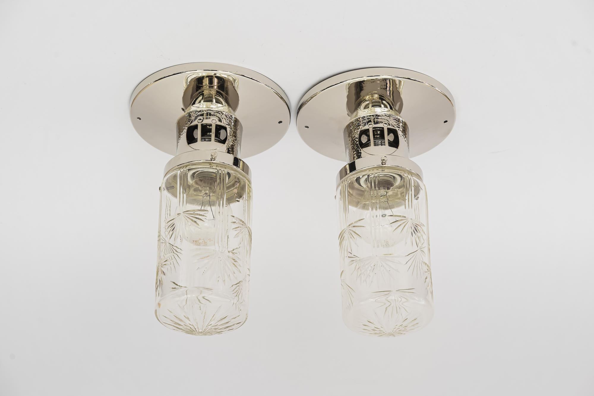 2 Art Deco hammered ceiling lamps. Vienna, around 1920s.
Original old cut glass shades.
 