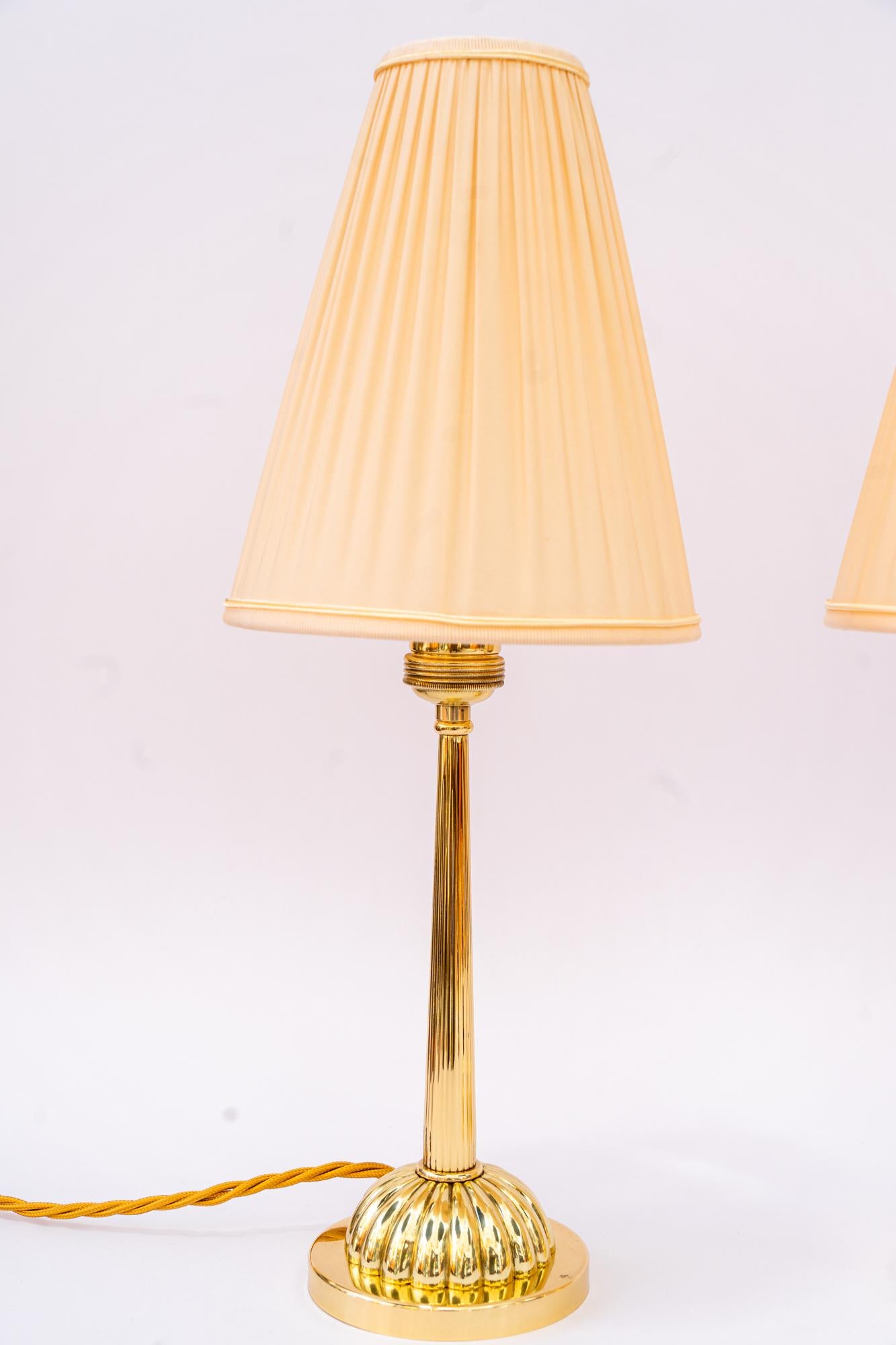 2 Art Deco Table lamp with fabric shades vienna 1920
Brass polished and stove enameled 
The shades are replaced ( new )
