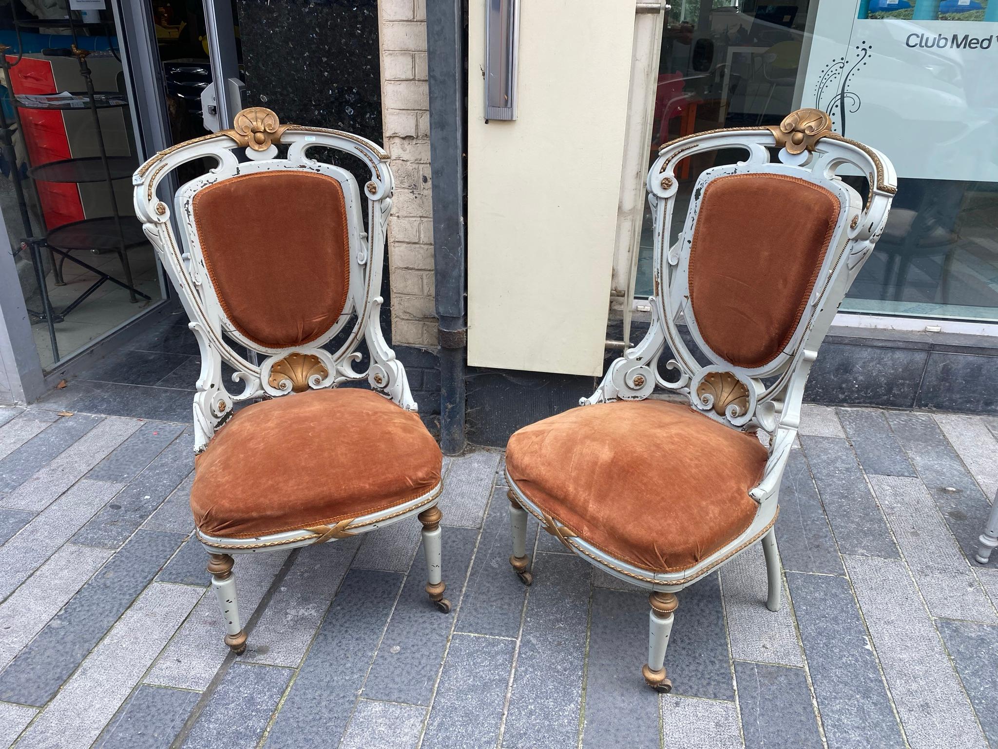 2 Art Nouveau Armchairs, circa 1900
In lacquered wood, gilded wood and bronze 
No breakage but there are some cracks.