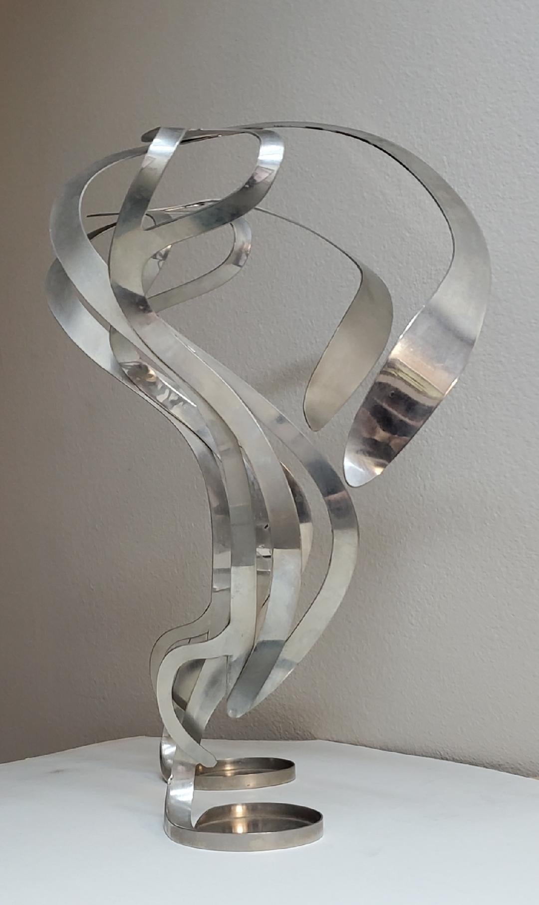 These Are A Pair Art Nouveau Styled Candle Holders Crafted Into Swirling Twirling Metal Smoke.
This Is A Beautiful Set Of Stainless Steel Candle Holders Which Alludes To The Motion Of Spiraling Smoke That Drifts Lazily Upward.
The Dimensions Are 21