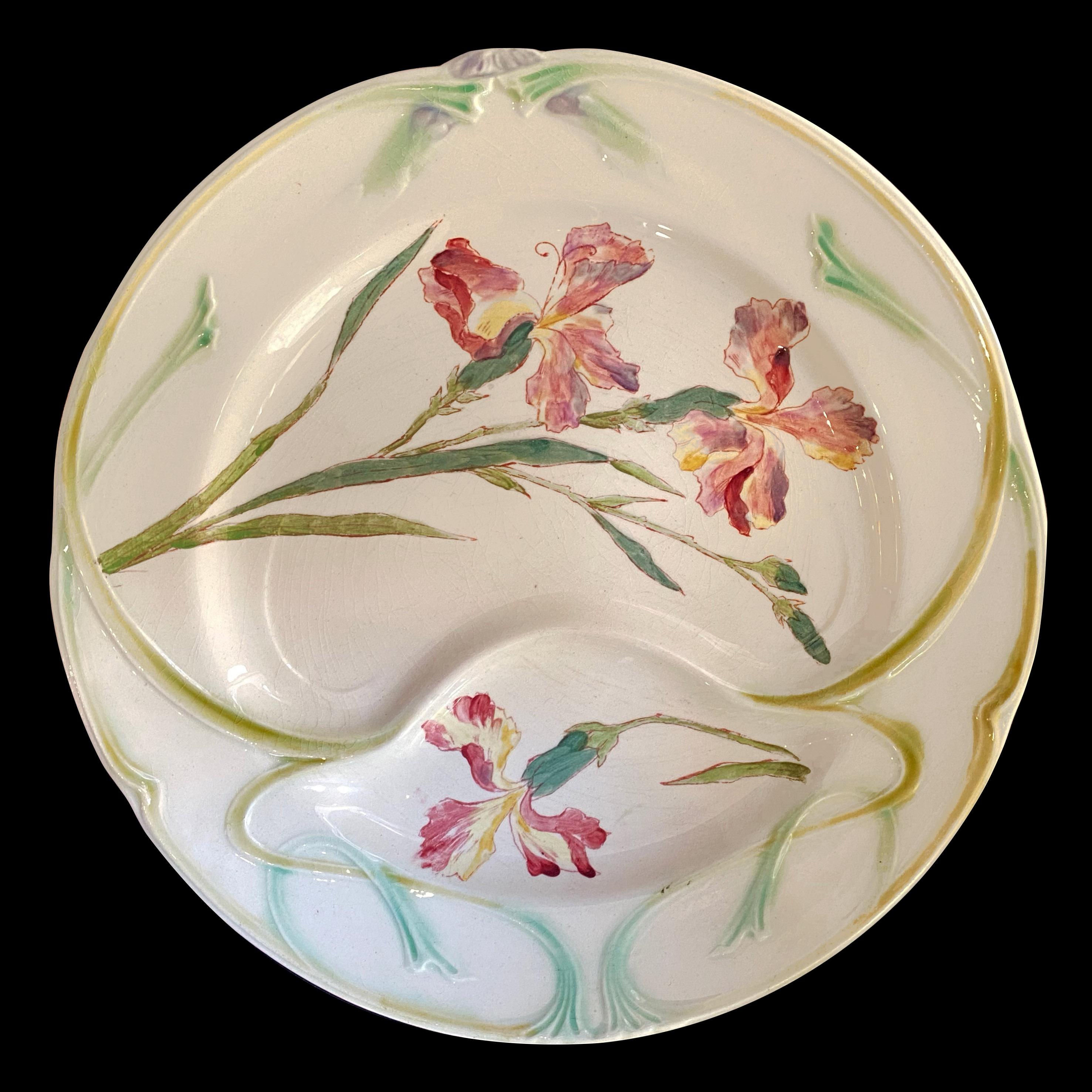 Unusual and colorful plates for Asparagus Iris are hand painted Iris. This 19th Barbotine is a remarkable French Art Nouveau Longchamp famous earthenware.