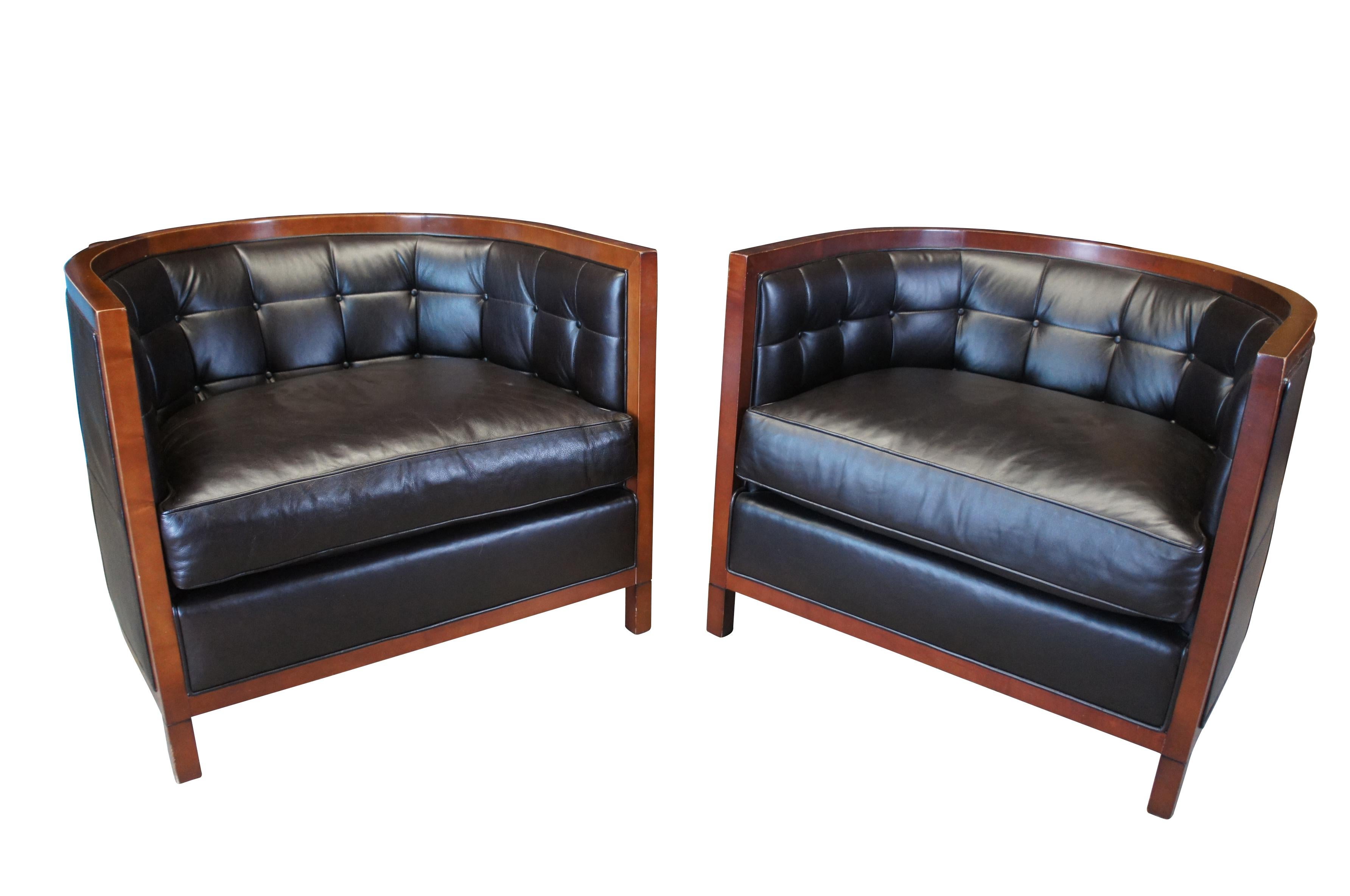 A gorgeous pair of library or club chairs by Baker Furniture.  The Archetype Round Tufted Club Chair features a plush leather seat and maple banded frame.  An updated barrel back chair. Perfect for any contemporary or modern space.  The chair is