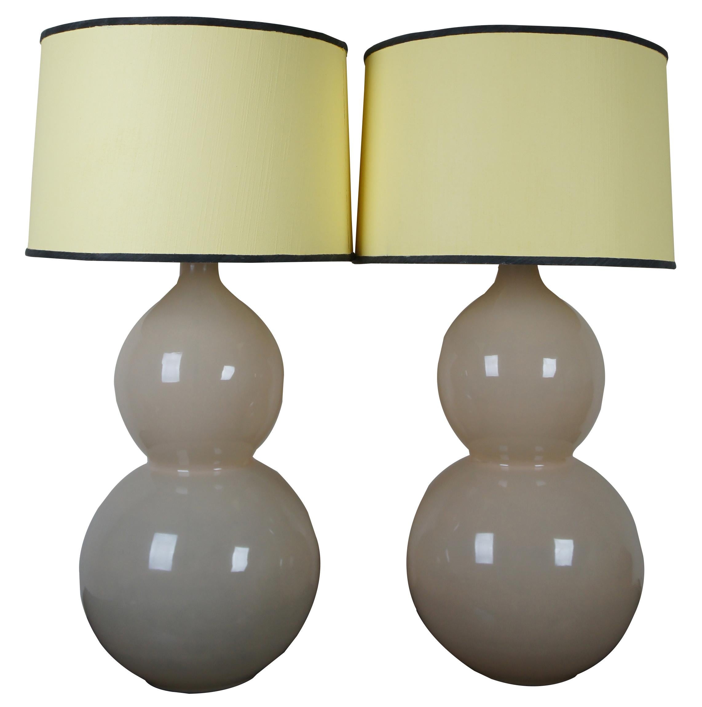 Celeste double gourd shaped glass table lamp pair designed by Suzanne Kasler for Ballard Designs. Shades have been painted yellow. Discounts available for those who don't need the shades.

Measures: 13” x 28” / shade - 18” x 12” / height with