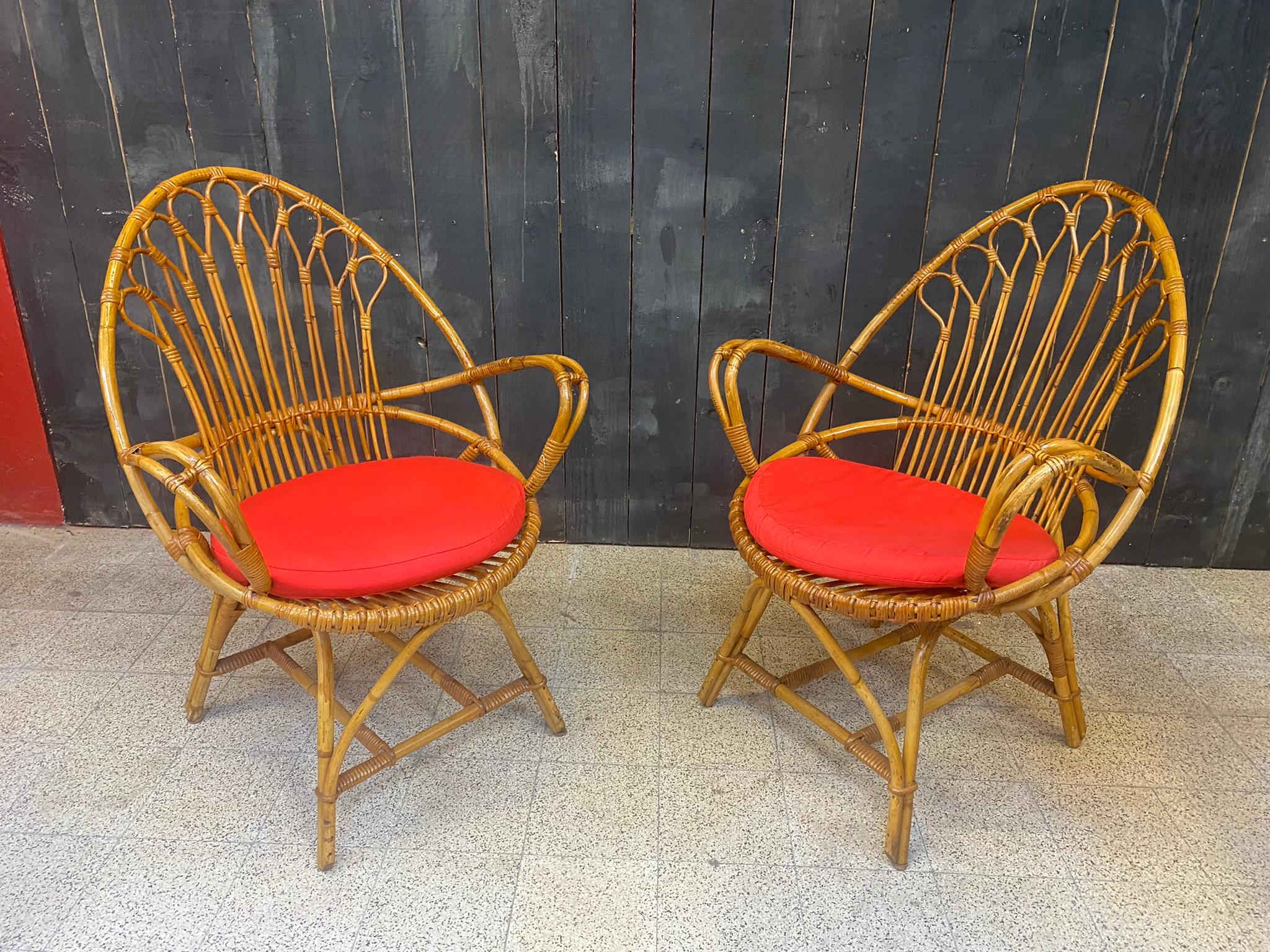 2 bamboo and rattan armchairs and their cushions circa 1970

structure and cushion in very good condition.