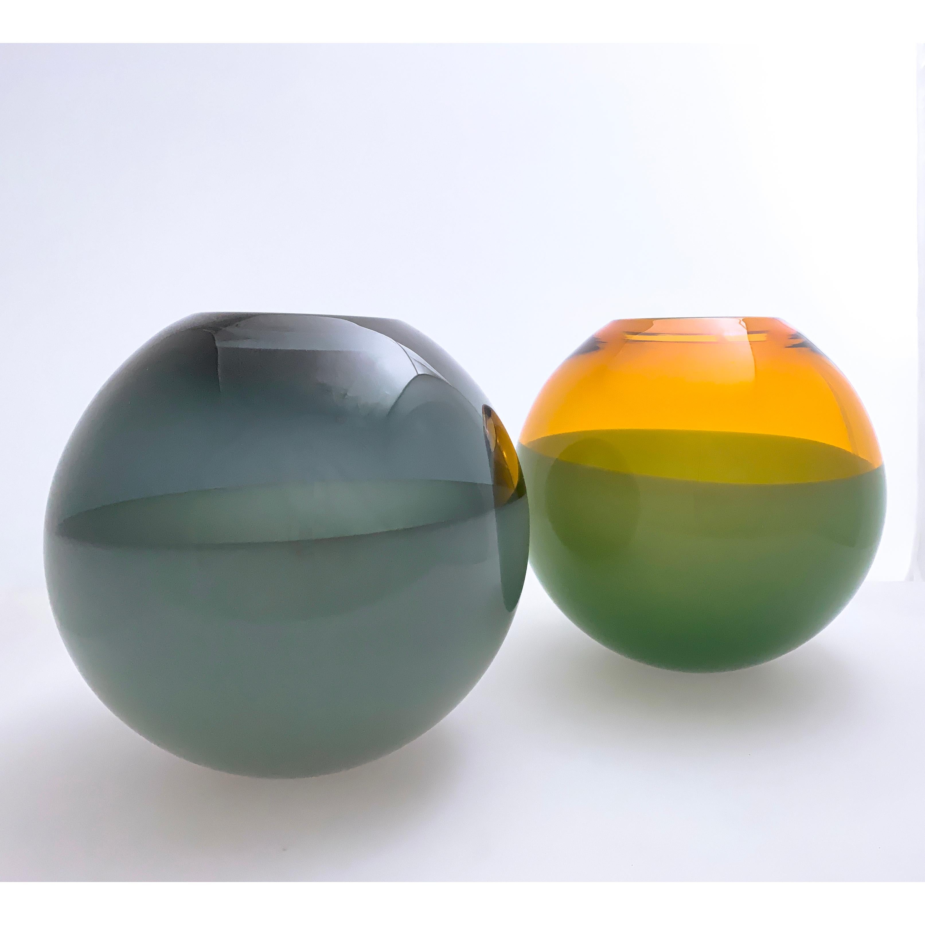 This is an original sample test and a one-of-a-kind shape. These works continue the language of contrast of the lattimo and banded lines but use two complementary colors. Hand blown and shaped in lead free crystal. Designed and made by Siemon and