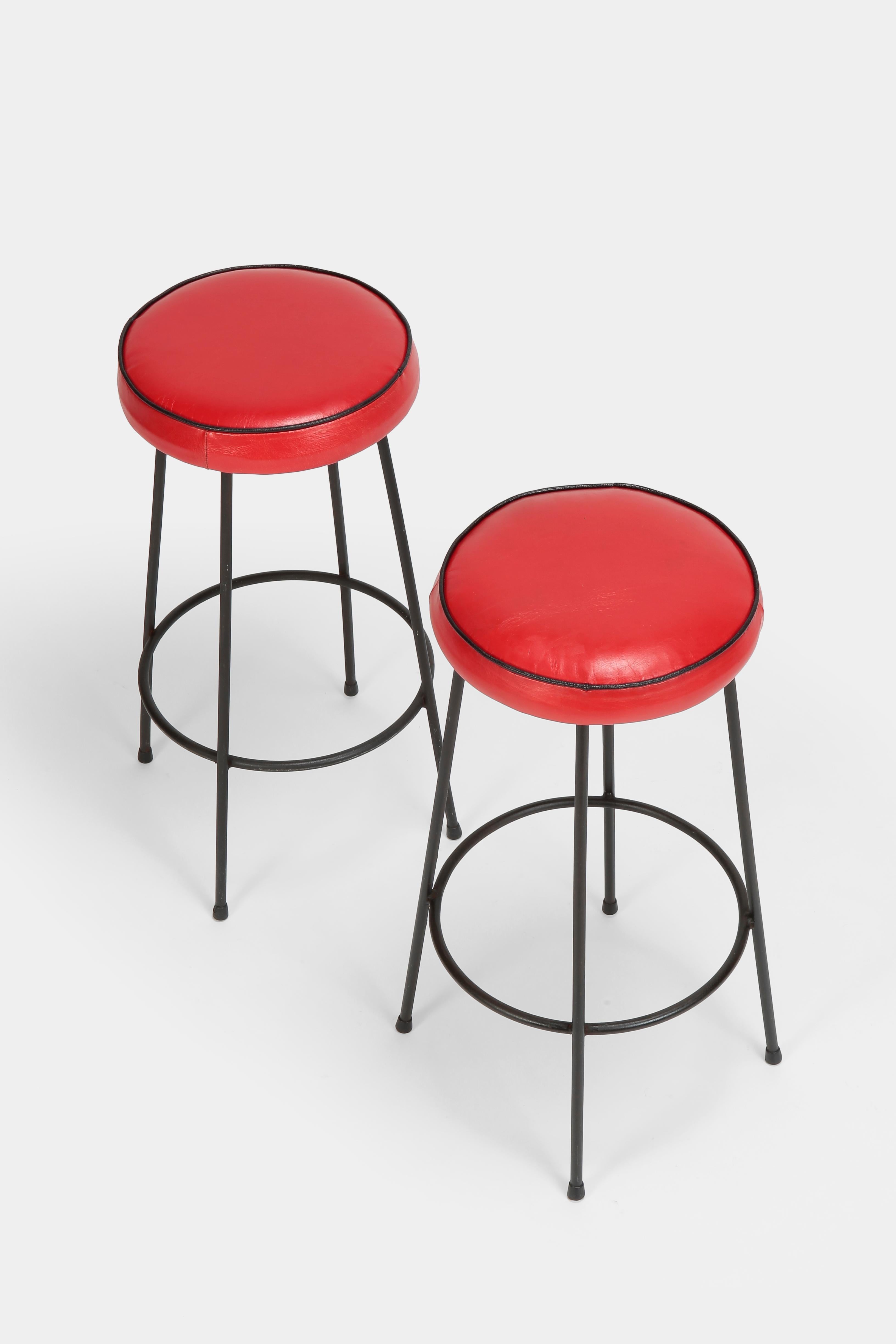 Pair of “Rockabilly” bar stools made in Italy in the fifties. Very nice hand sewn goatskin seats, solid steel tubular frame, newly upholstered. Sturdy and a lot of fun.