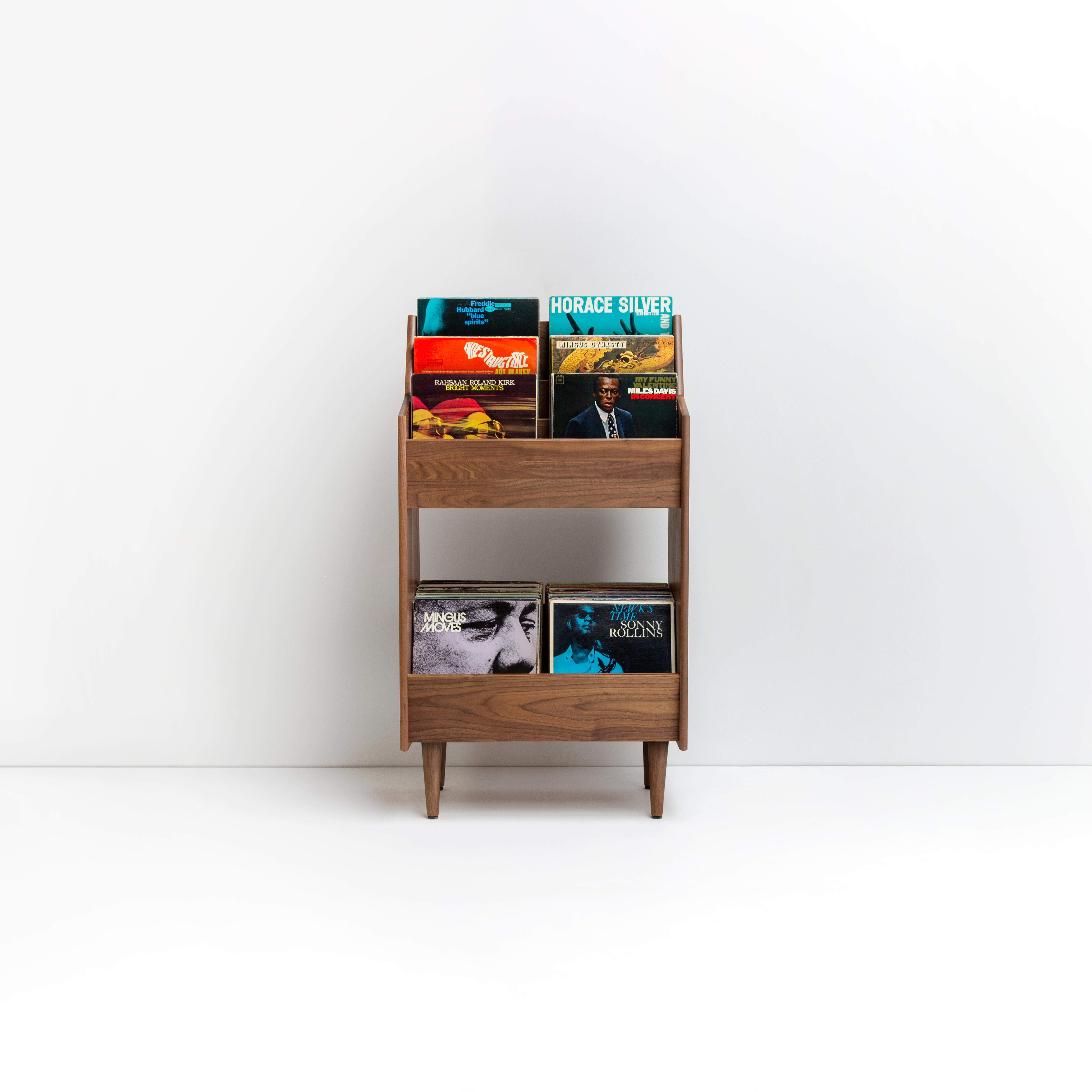 Luxe record stands elegantly display record cover art while providing easy access to as many as 350 records. All of our cabinets are hand-built in the United States from sustainably harvested solid Ash and Walnut, available in a range of finishes.