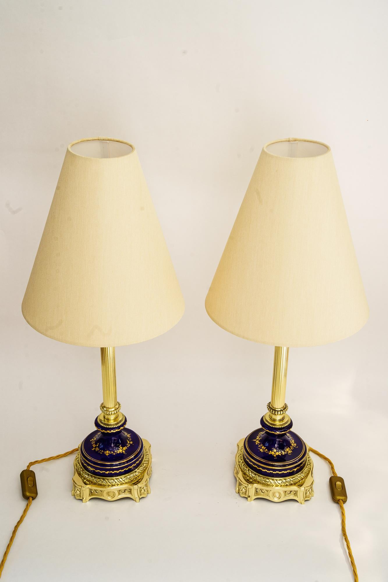 2 Big Historistic Table lamp vienna around 1890s
Ceramic gilted
Brass polished and stove enameled
The fabric shade is replaced ( new ) 
