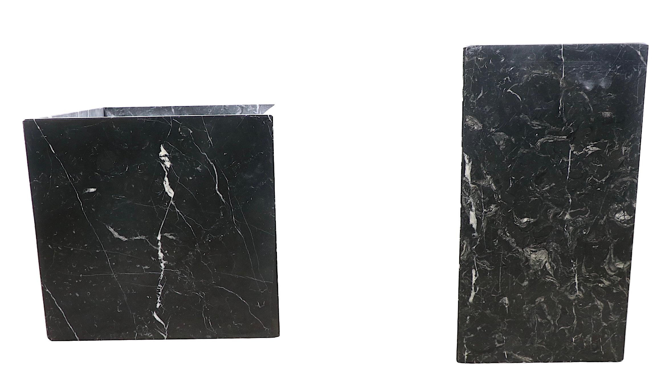 Offering two rectangular table bases, which can also double as pedestals, planters, or whatever you can think of. The black marble columns are constructed of four slabs each, one is taller and more narrow ( 10.5 x 10.5 x 19 inches ) the other is
