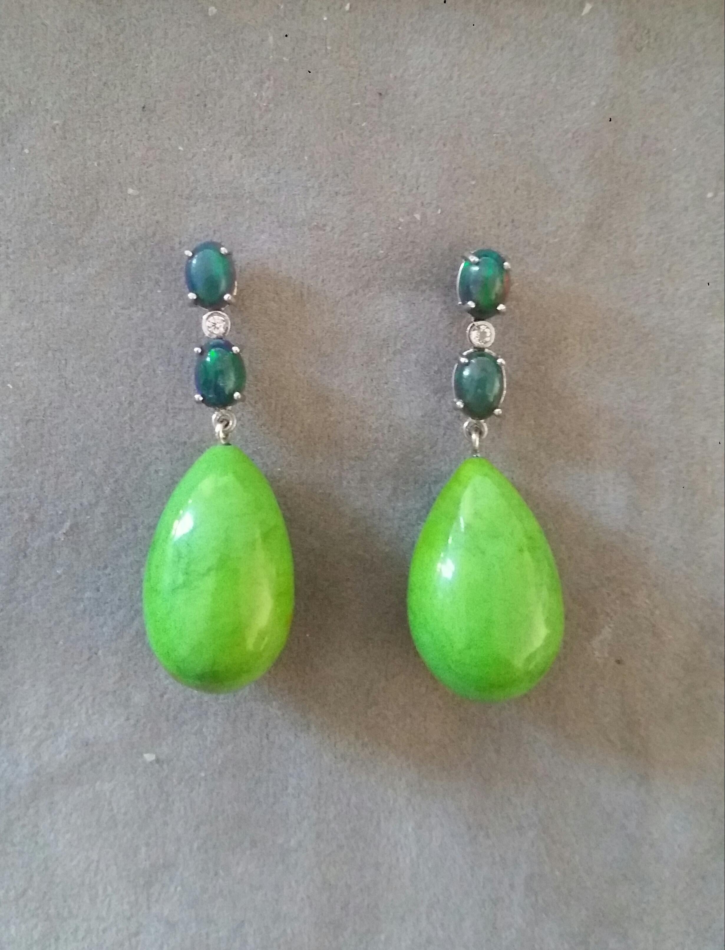 Elegant and completely handmade Earrings consisting of an upper part of 2 oval shape Natural Black Opal  cabs of 5 mm x 7 mm set together in 14 Kt white gold with a  small diamond in the middle, at the bottom 2 Turkmenistan Green Turquoise Drops