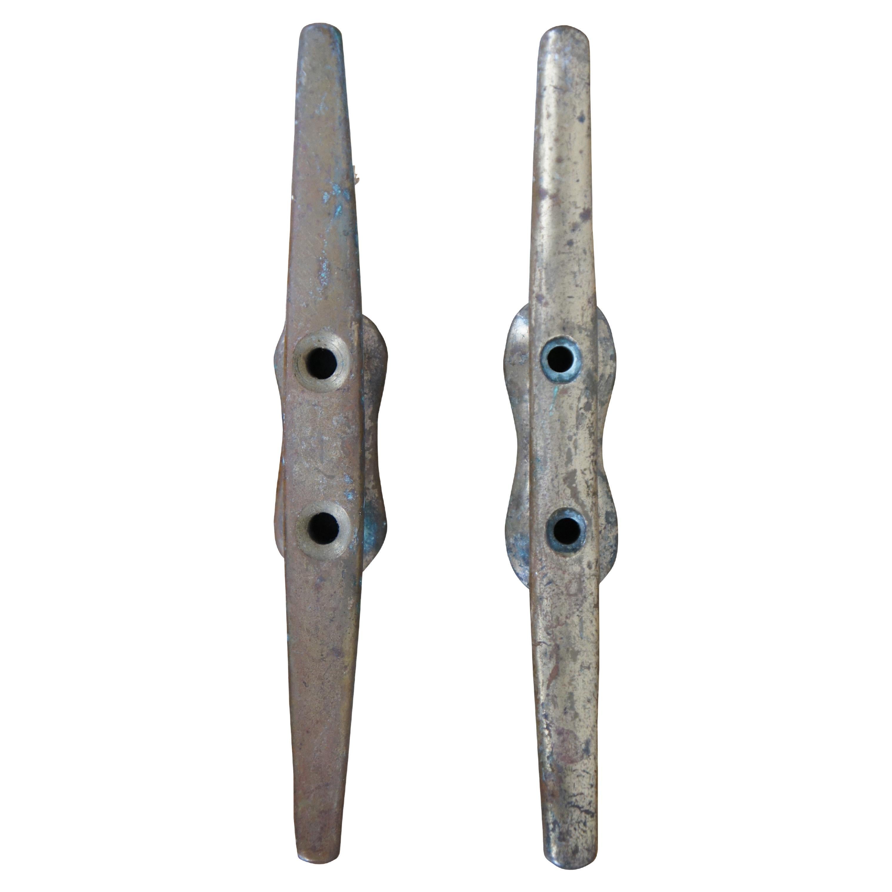 Pair of vintage brass horn cleat hooks, typically used as tie downs for nautical rope at docks and on boats. One marked 2054 on reverse.


DIMENSIONS
1.125