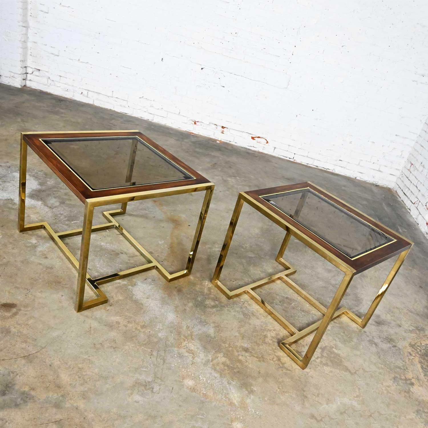 Wonderful pair of modern brass plated dark wood & smoked glass end tables in 2 sizes, 1 larger rectangle and 1 smaller rectangle. Comprised of polished brass plate frames with a top of dark wood and beveled smoked glass inserts, by Thomasville