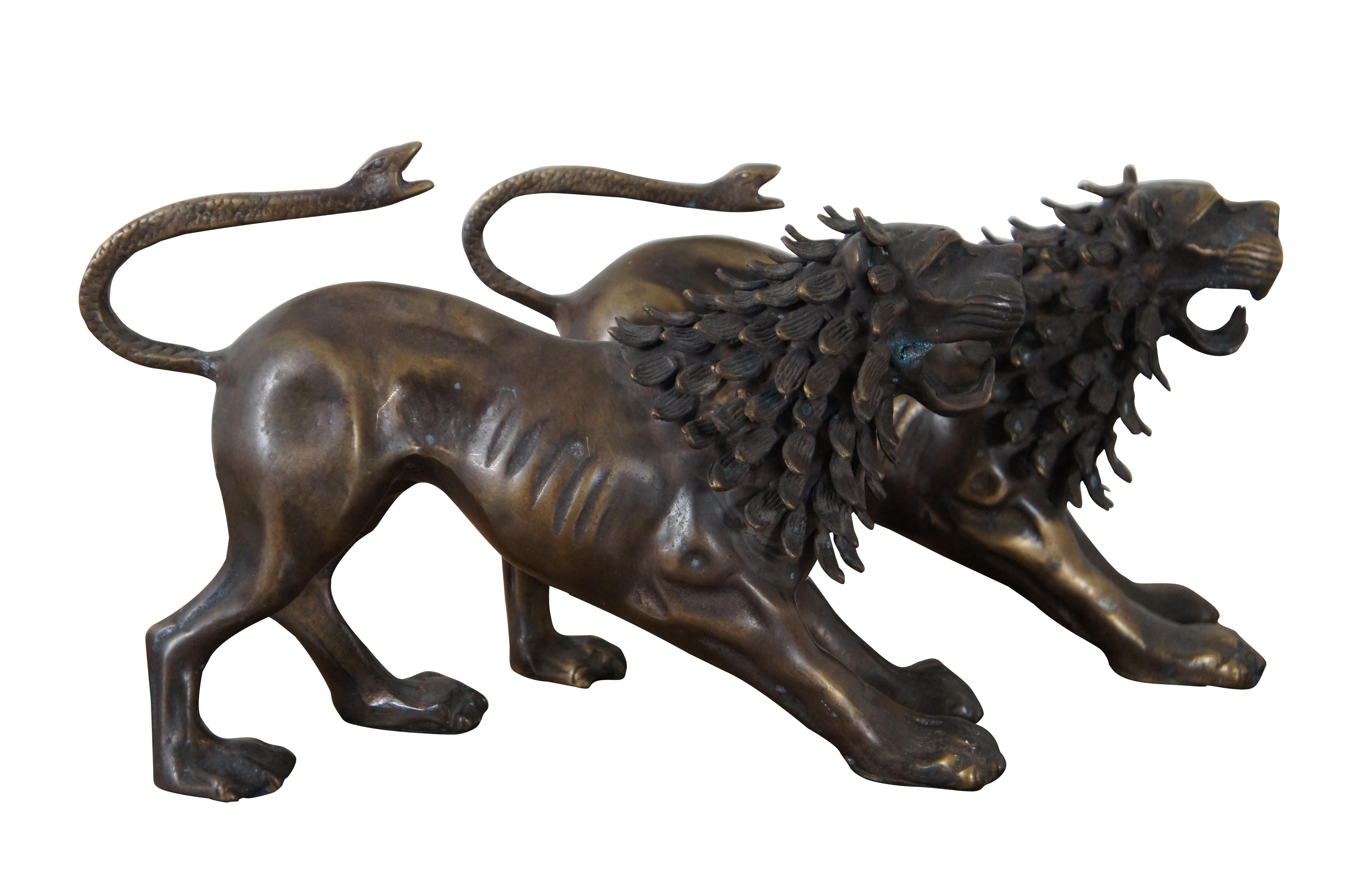 Pair of bronze mythological guardian lion / fu / foo dog figurines with pine cone like manes and snakes for tails. The style and stance are nearly identical to the Chimera of Arezzo – an ancient Etruscan sculpture – however these figures are missing