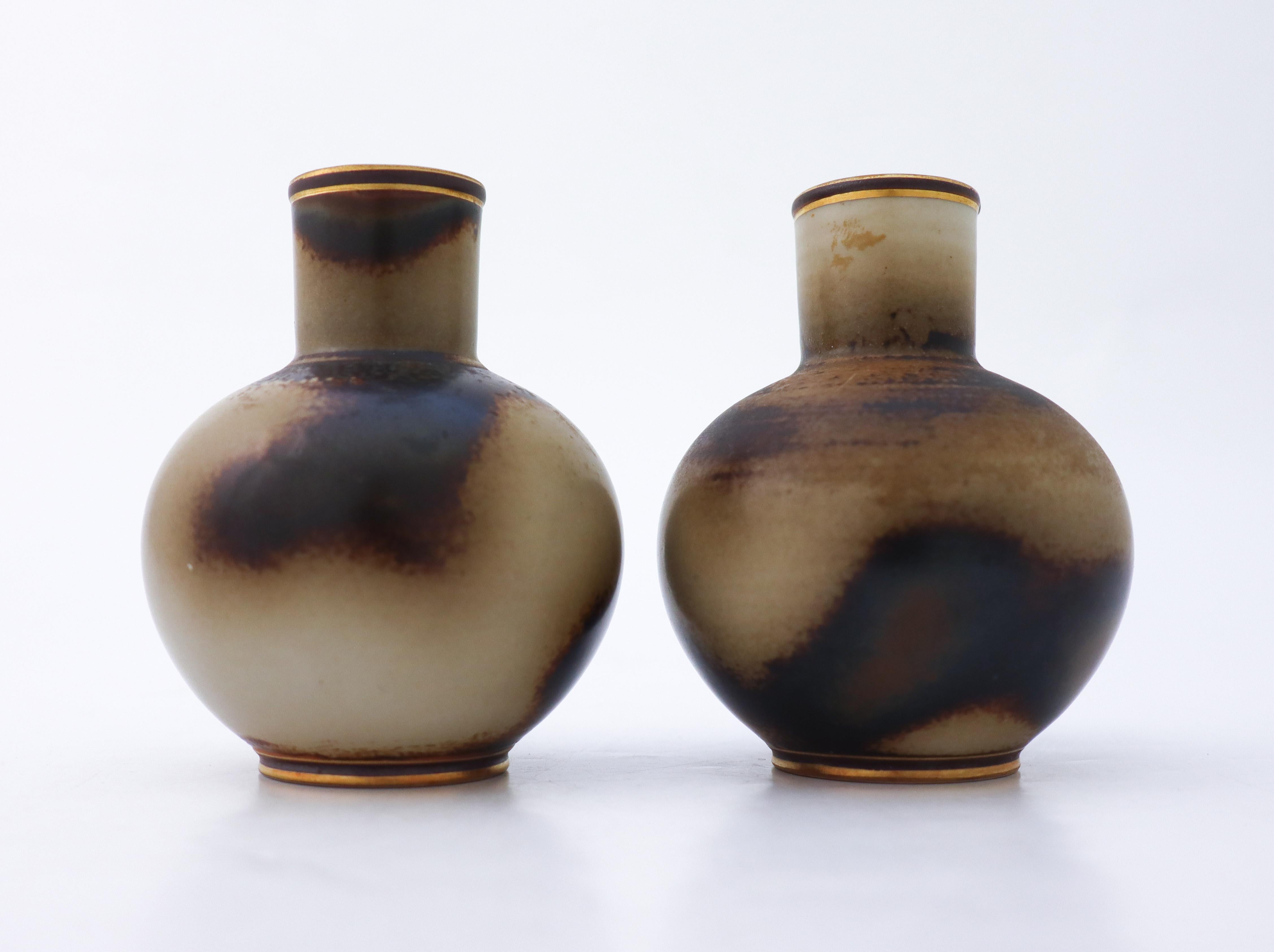 A pair of lovely, brown vases designed by Gunnar Nylund at Rörstrand of model Flambé, they are 10 cm (4
