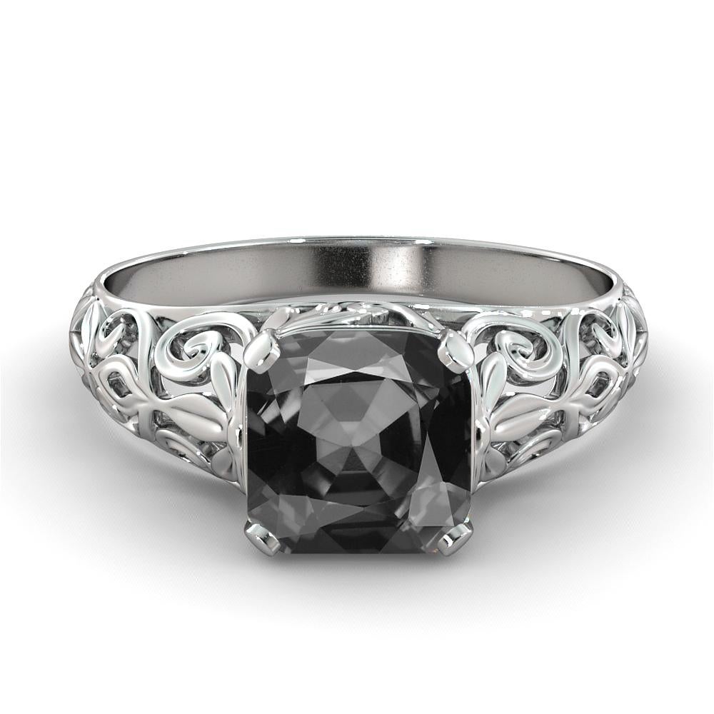 Beautiful vintage style black diamond ring. Center stone is 2 carats, natural, cushion shaped, AAA quality black diamond. Set in a sleek, 14K white gold, solitaire ring with a 4-prong setting, this fantastic piece is guaranteed to delight for
