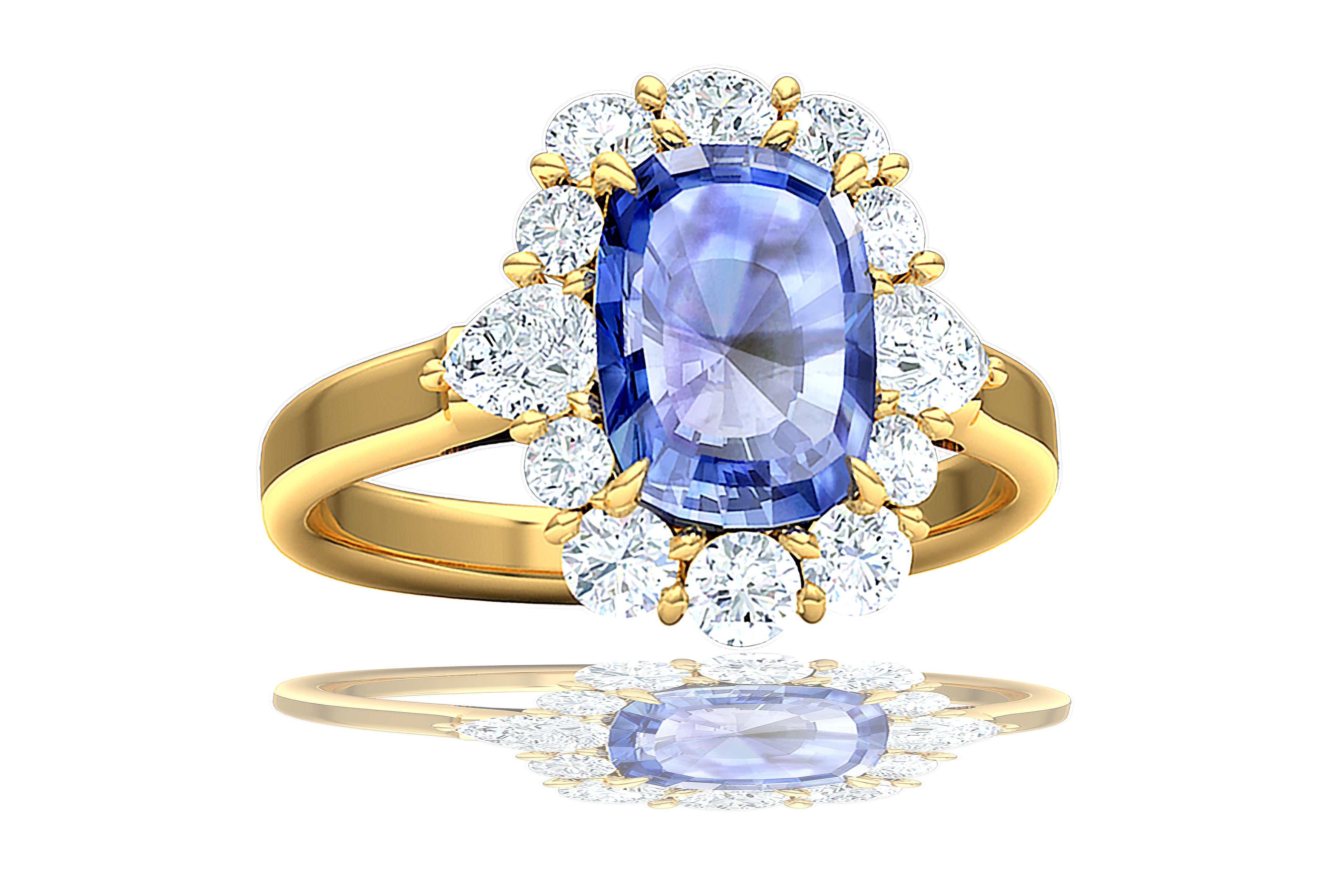 A beautiful elongated cornflower Ceylon Sapphire is complimented by over one carat of round brilliant and pear shape diamonds.  The diamonds have a color and clarity of G-H VS-SI.  The diamonds are set in a shared prong style and set in 18k yellow