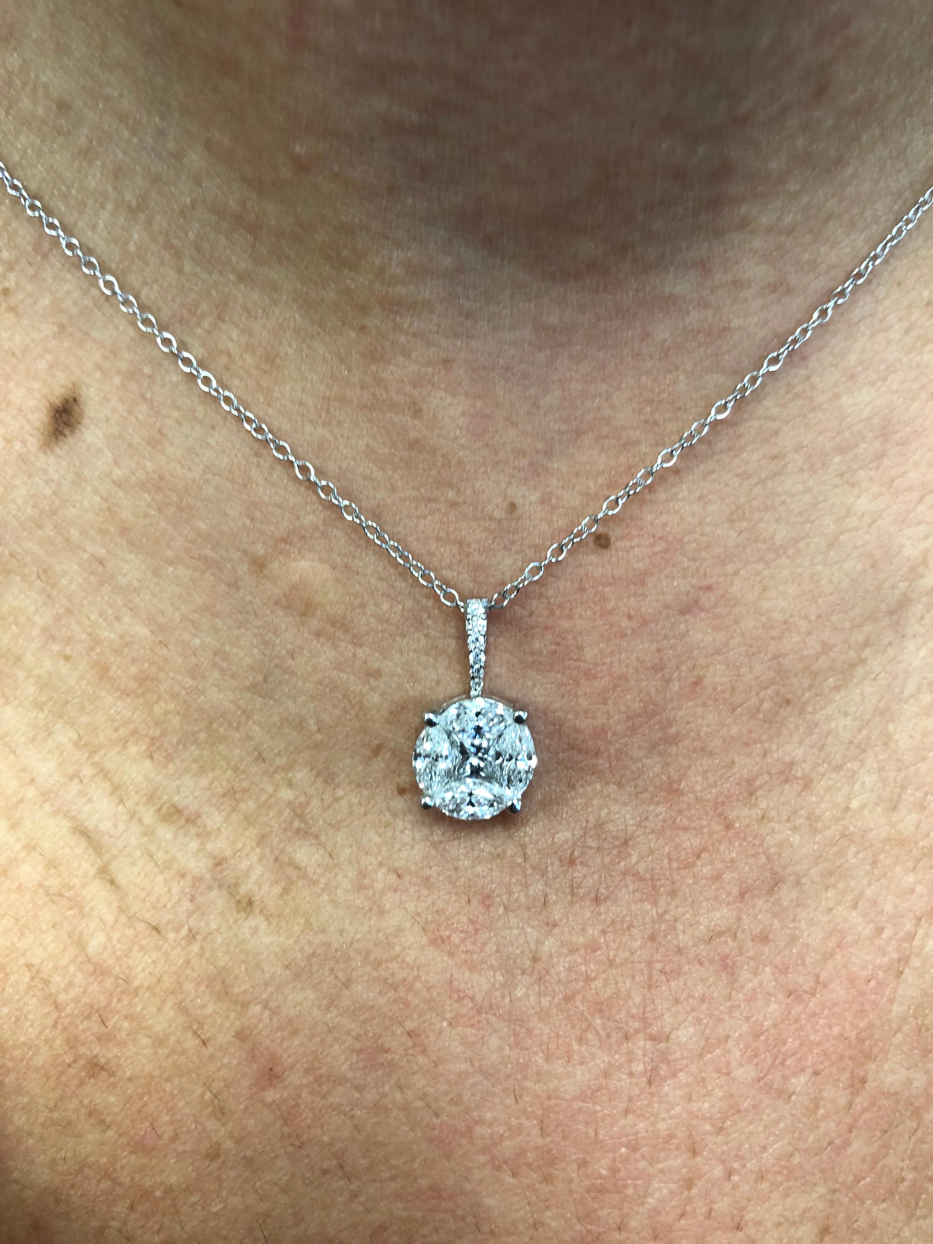 18K white gold circle pendant set with a princess stone in the center and 4 marquise diamonds around to create the illusion of a 3 carat round diamond. The total weight of the circle pendant is 2.06 carats. The color of the stones are F, the clarity