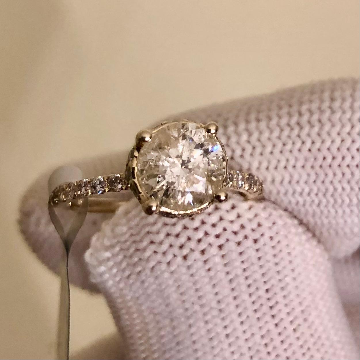 Stunning approx. 2 Ct natural round brilliant diamond hidden halo engagement ring in 14k yellow gold. The center diamond is natural and certified with an appraisal value of $8,580.00. A 1 1/2 carat round natural solitaire diamond is surrounded by