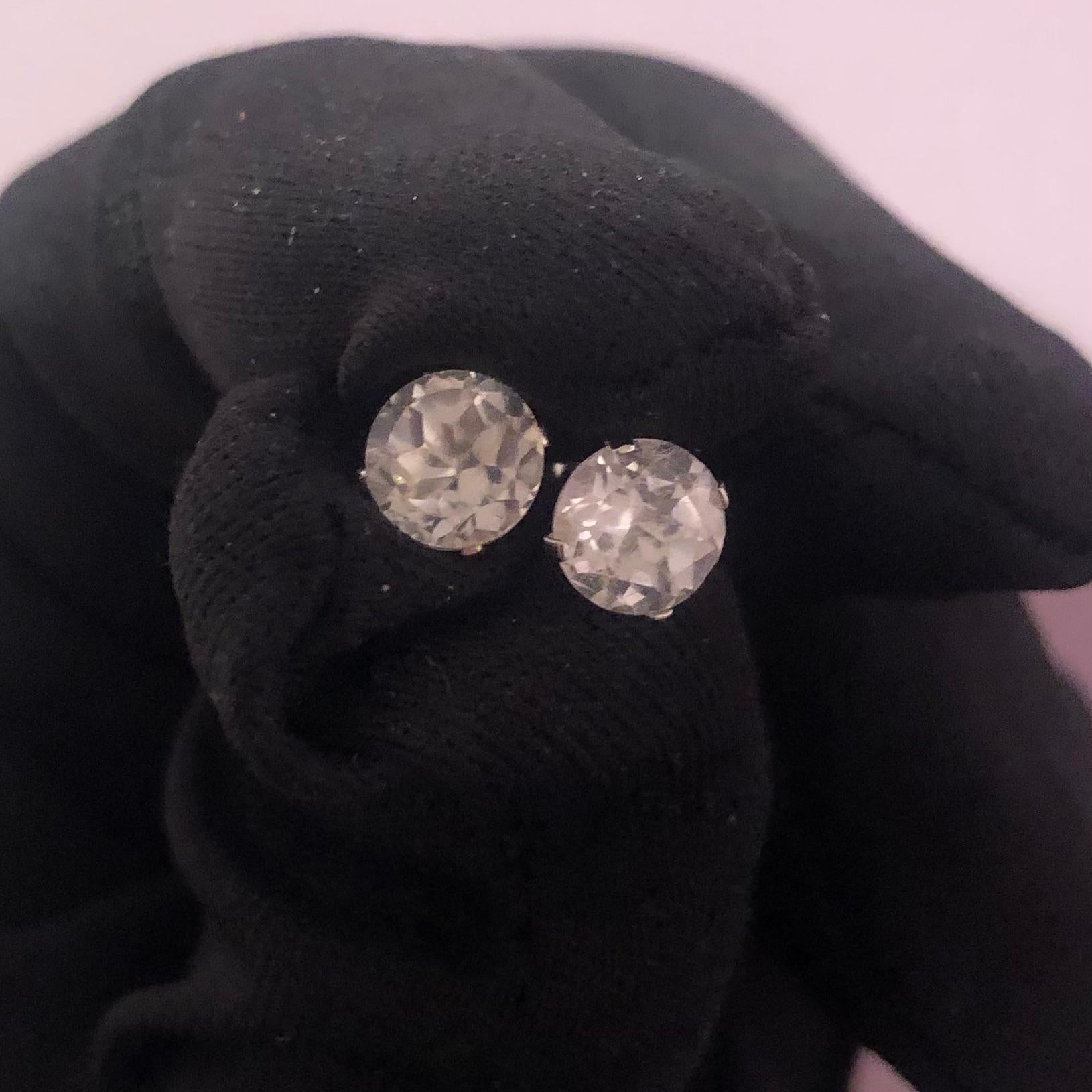 Classic 2 Carat solitaire white topaz stud earrings in 925 silver. Pair of natural earth-mined white topaz stud earrings weighing approx. 2.00 carats are prong-set in these 925 silver basket studs.

White topaz stud earrings come with a fine velvet