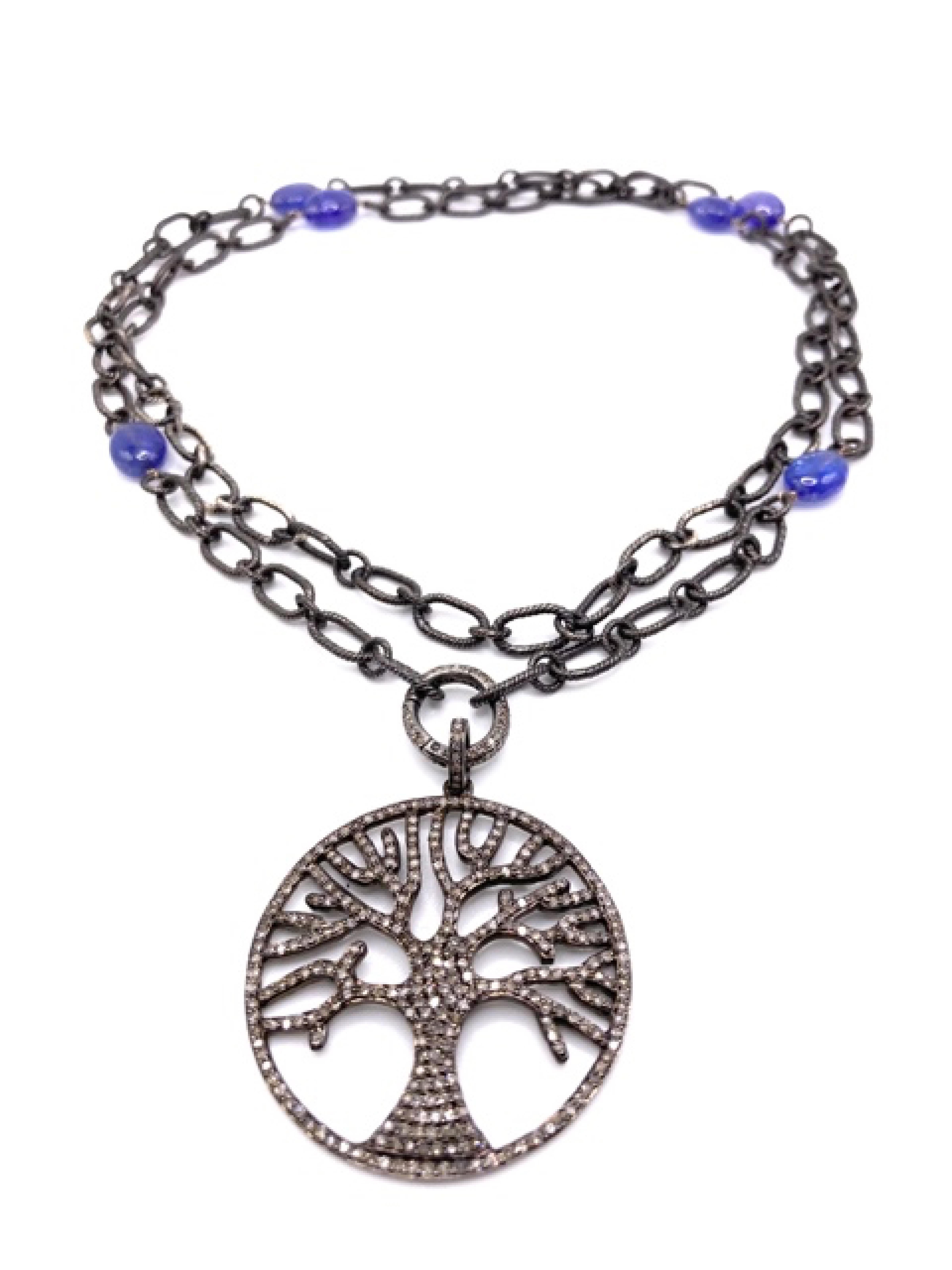 This long Necklace is made of vintage silver with Tanzanite beads and can be worn doubled with a front clasp. The Tree Of Life pendant has 2 Carat of black brilliant cut Diamonds.