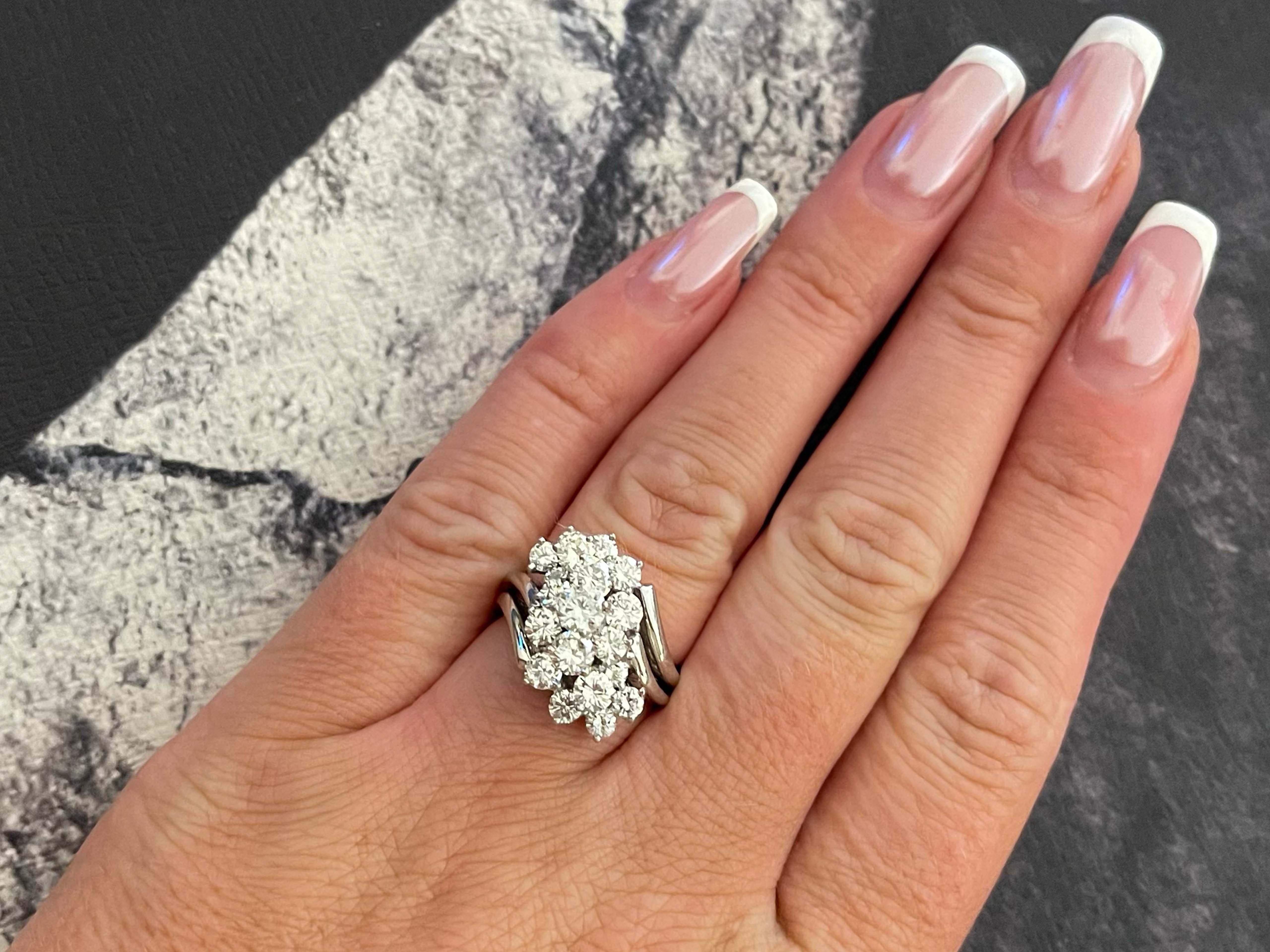 Item Specifications:

Metal: 18k White Gold 

Diamond Count: 19 brilliant cut

Diamond Carat Weight: ~2.00 carats

Diamond Color: G

Diamond Clarity: VS1-SI1

Ring Size: 6.25 (resizable)

Total Weight: 7.7 Grams

Stamped: 