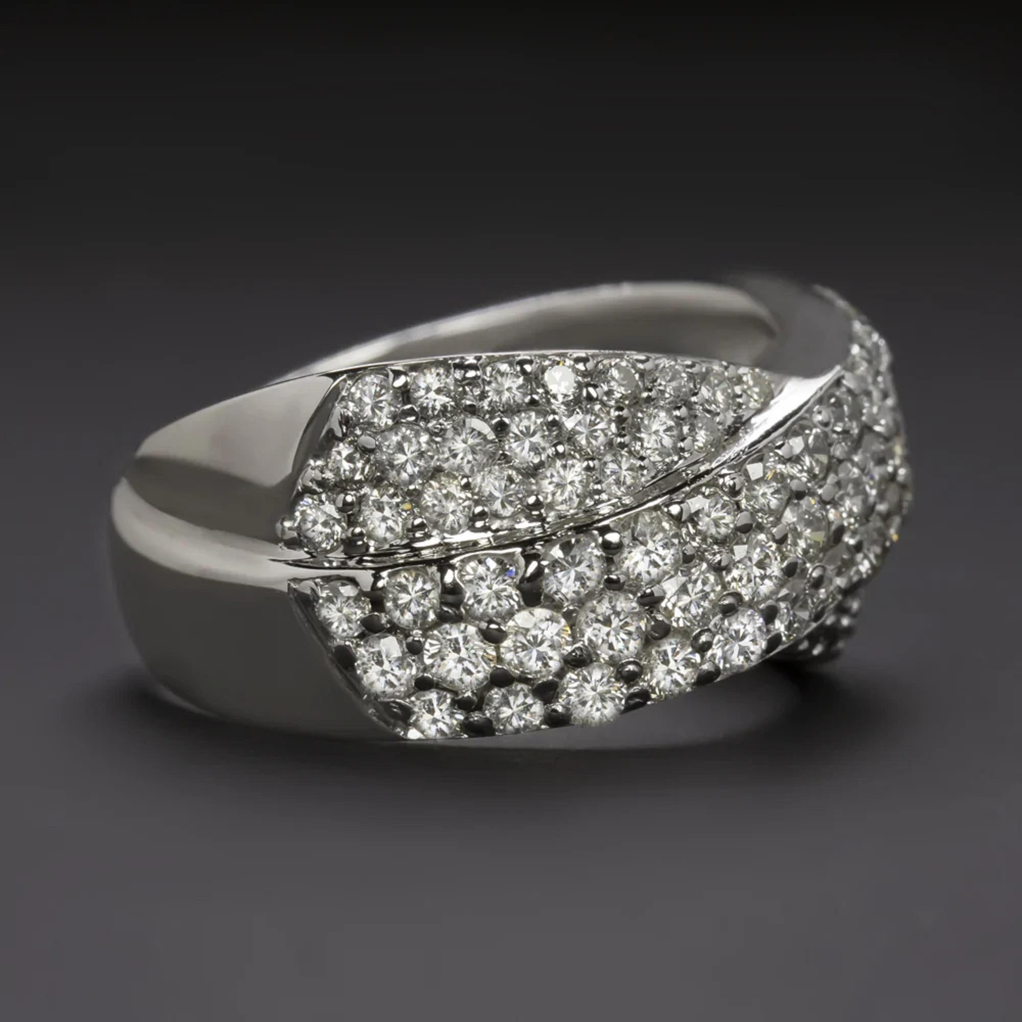 two carats of high quality diamonds, this solid white gold cocktail ring is full of glamorous sparkle! The ring is elegantly designed in 14k white gold with dynamic, interwoven bands of pave set diamonds. Measuring over 10mm across, the ring has a