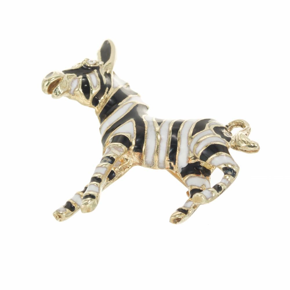 Vintage 1980's solid 14k gold black and white enamel Zebra brooch. Highly detailed Black and white enamel encased with yellow gold framing with a single cut diamond. The pin stem is 14k rose gold. 

1 single cut diamond, G VS approx. .2cts
14k