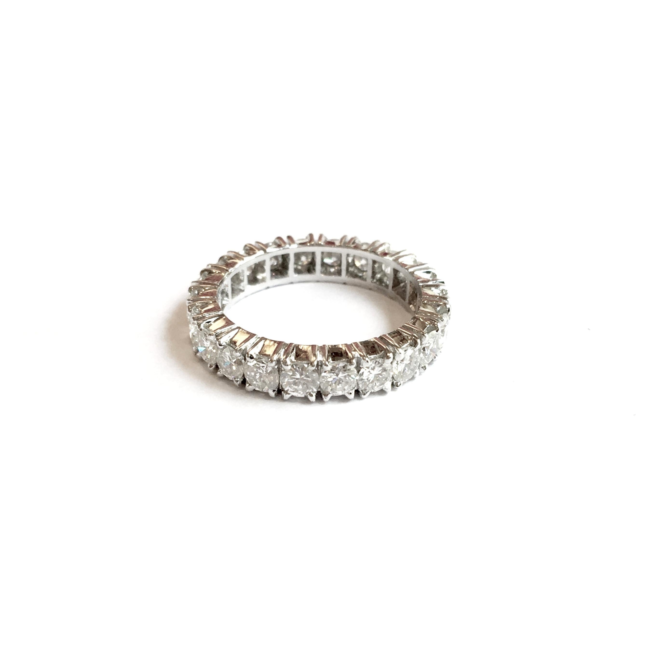 An elegant 18k white gold diamond set full eternity ring. The ring is set with 22 round brilliant cut diamonds each individually set within a four claw setting totalling approximately 1.98 to 2.10 carat, F/G in colour and VSI in clarity. 
Each