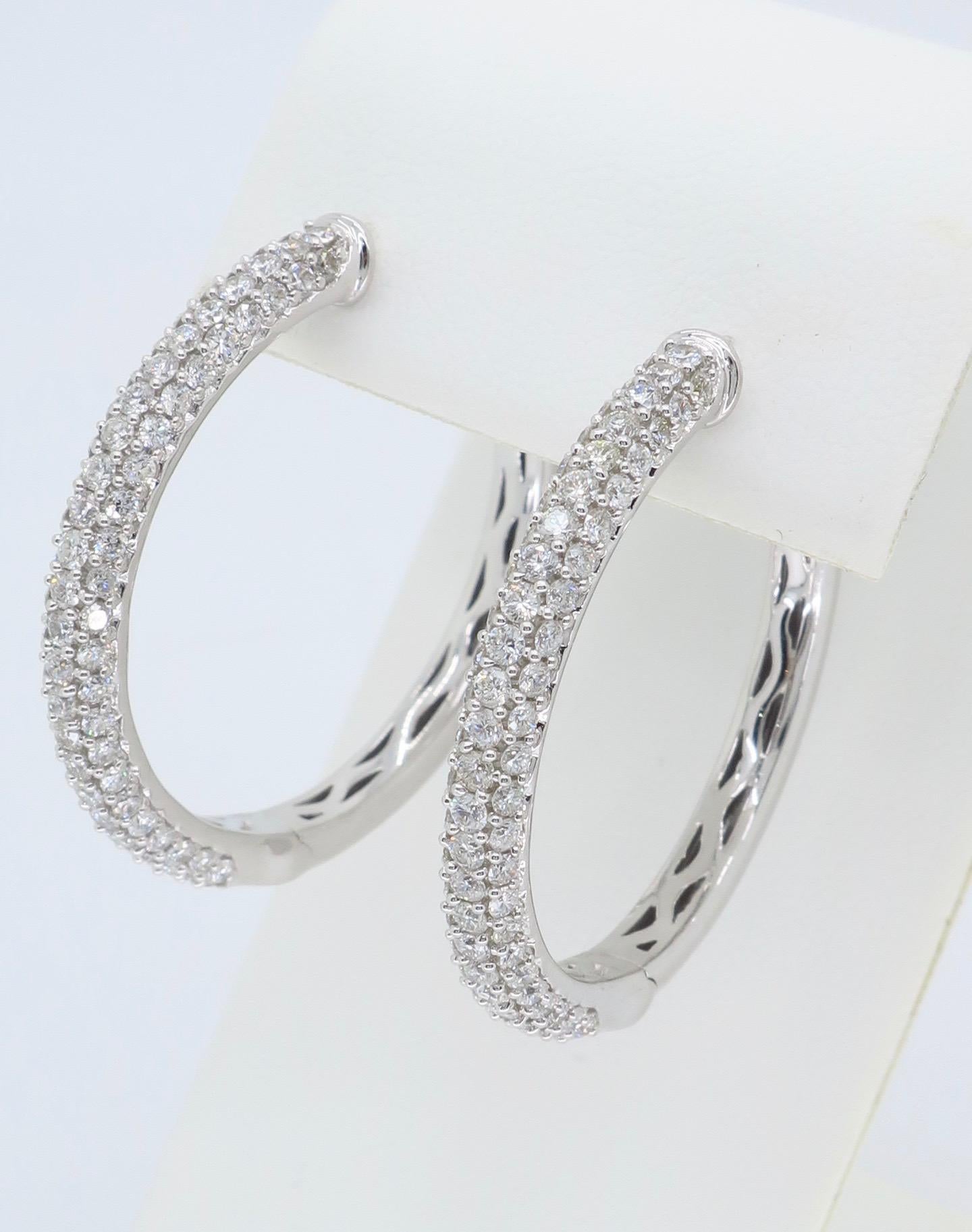 These beautiful hoops feature approximately 2.33CTW of Round Brilliant Cut Diamonds.

Diamond Carat Weight: Approximately 2.33CTW
Diamond Cut: 146 Round Brilliant Cut Diamonds
Color: Average G-I
Clarity: Average VS-SI
Metal: 18K White