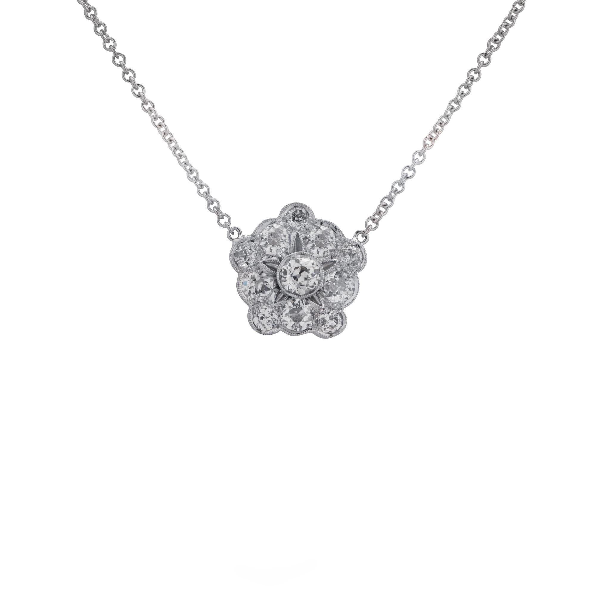Gorgeous necklace and pendant crafted in platinum and 18 karat white gold featuring 11 European cut diamonds weighing approximately 2 carats total, G-J color VS-SI clarity set in a whimsical flower. The 1 mm chain measures 18.5 inches in length. The
