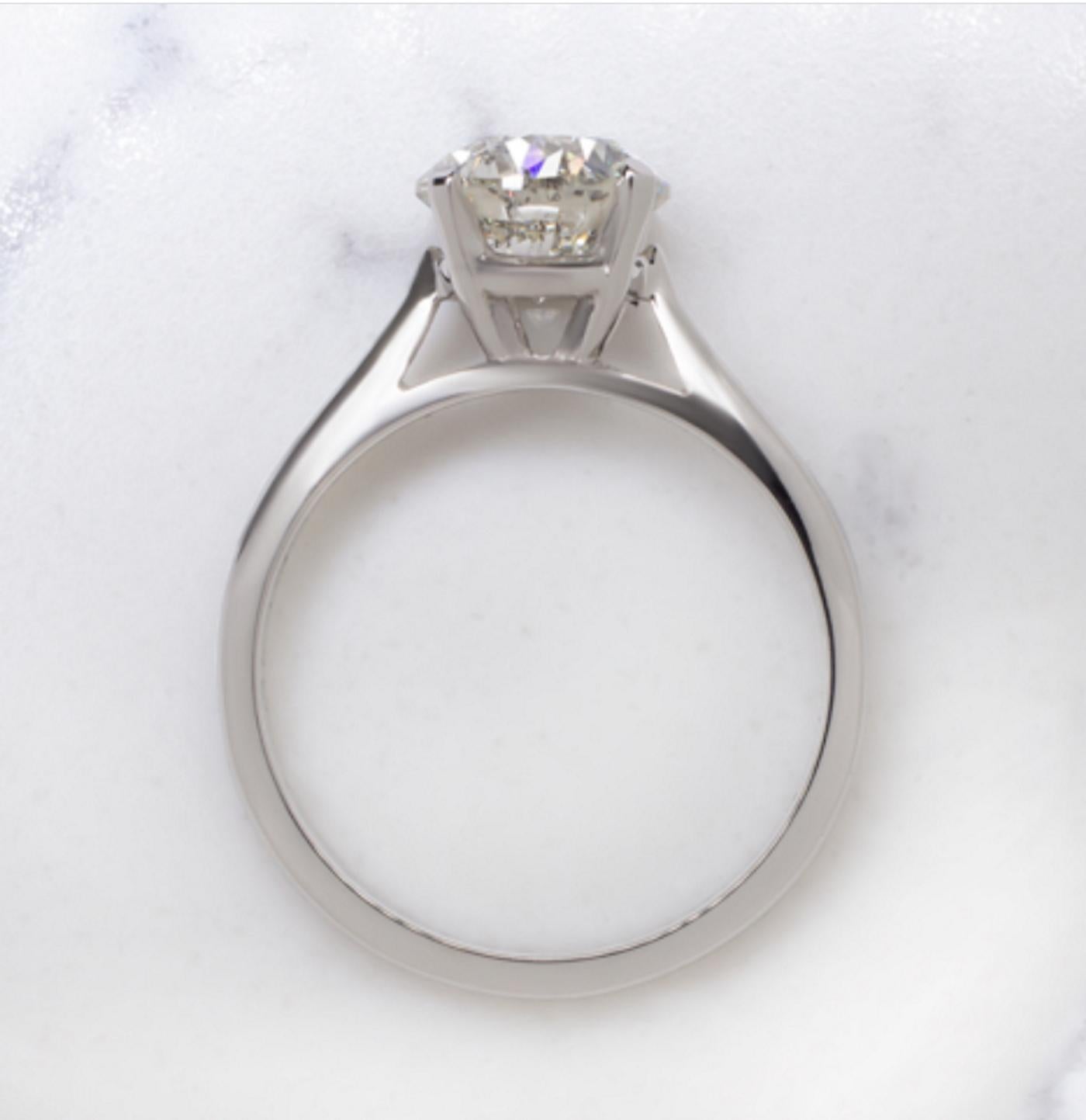 Amazing solitaire ring features an absolutely gorgeous 2.01 carats natural diamond set in a gorgeous platinum setting.
Exceptionally well cut, the diamond displays phenomenal, mesmerizing brilliance! Beautifully white and eye clean.
This beauty is a