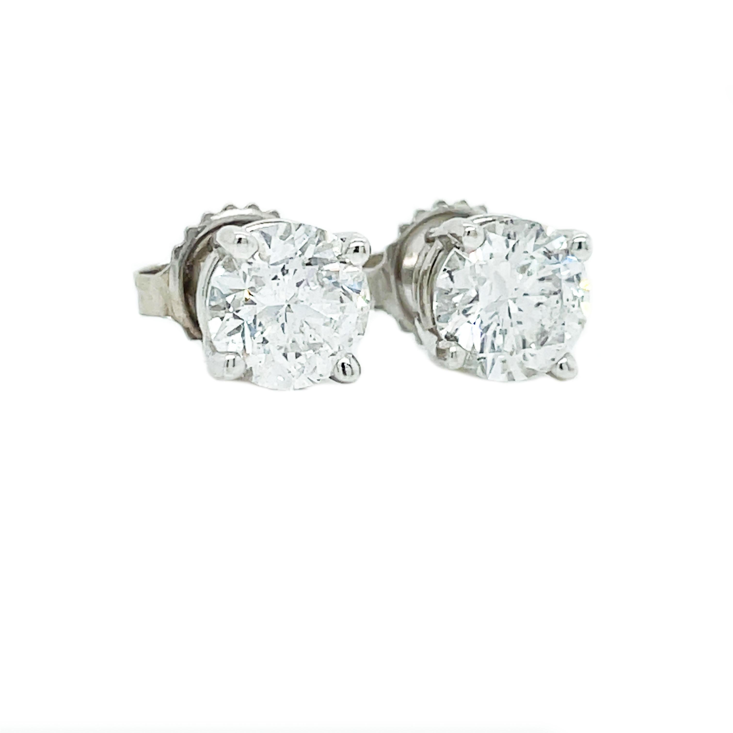This is a gorgeous pair of 14K White Gold studs in a basket setting showcasing two bright white and dazzling round diamonds. What, you still don't have any?! It's time to change that! Every woman needs a pair of eye-catching diamond studs, and these