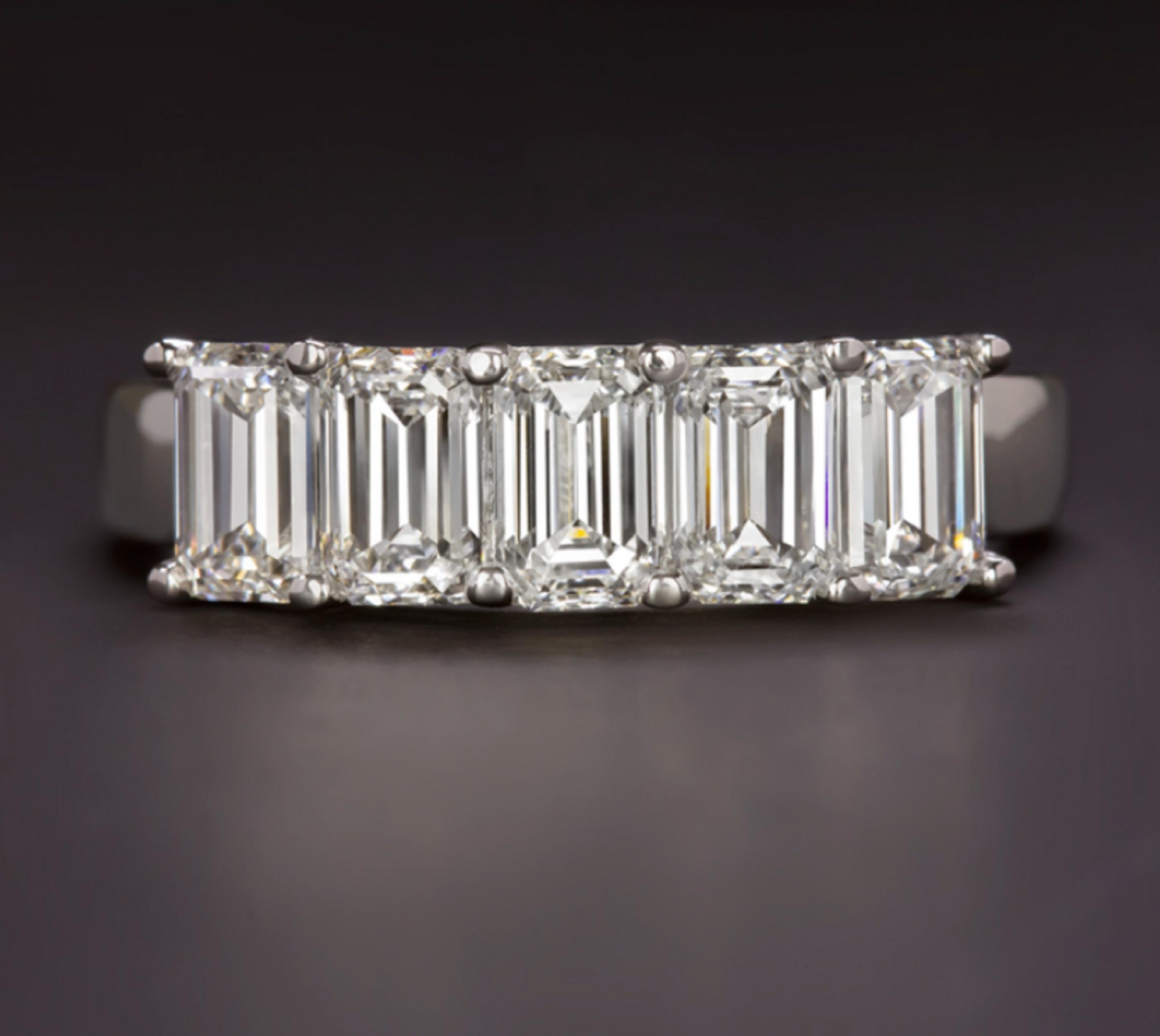 striking ring features 2 carat of vibrant emerald cut diamonds set in an elegantly simple modern band. Five high quality, perfectly matched, and substantially sized diamonds cover the face of the ring in dazzling sparkle. Bright white and