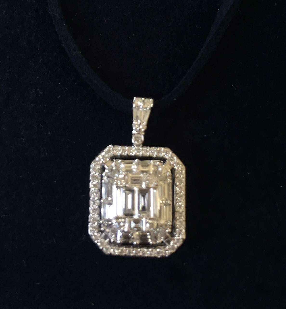 This pendant consists of a multi-cut stones that create the illusion of a big single stone. The total wt. of the pendant is 2.06ct. The color is G and the clarity VS1. This stunning piece is pure elegance.

All our pieces come with an appraisal