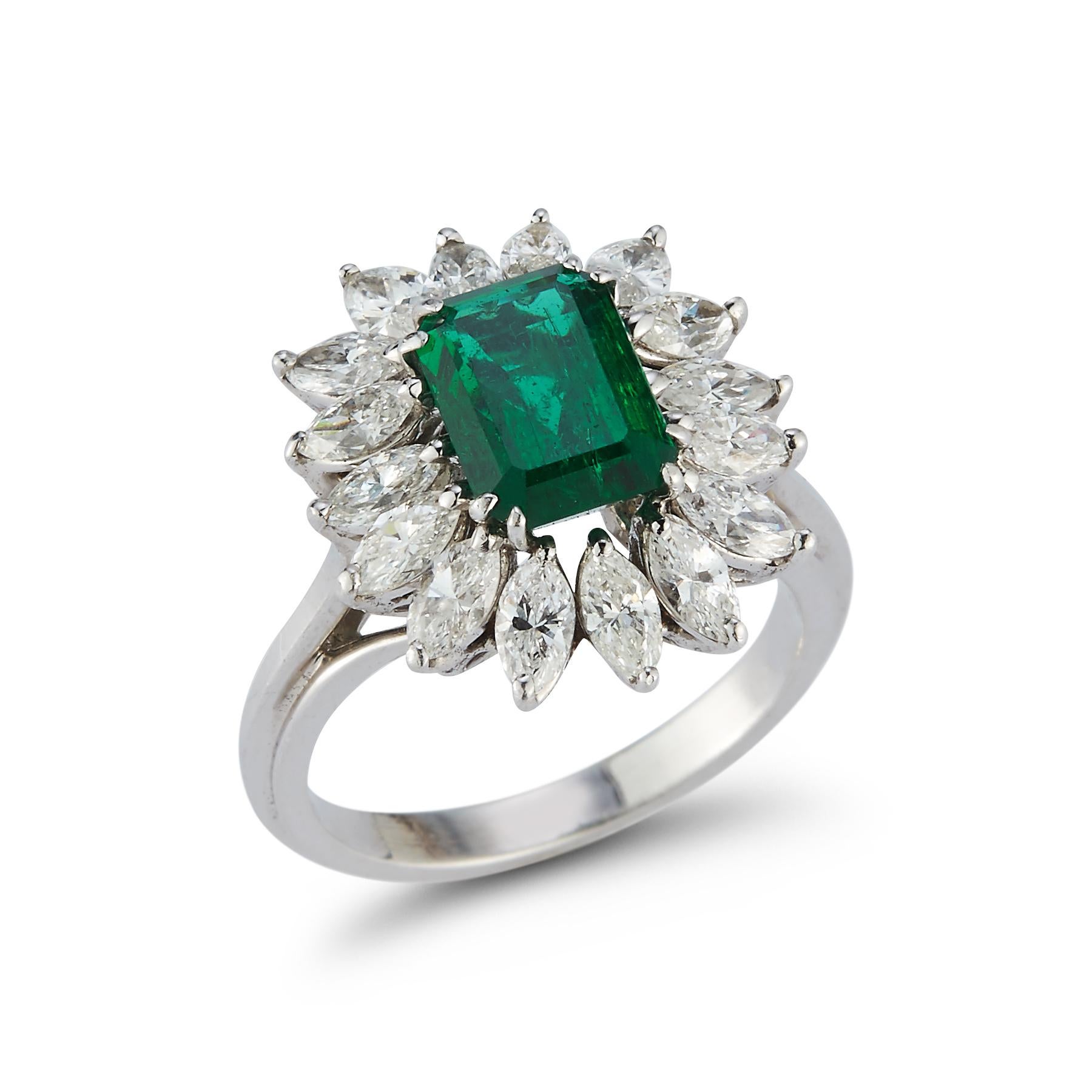 2.00 Ct Emerald Cut Emerald & Diamond Ring 1 emerald surrounded by 16 marquise cut diamonds set in platinum

Emerald Weight: approximately 2.00 cts 

Diamond Weight: approximately 1.92 cts 

Ring Size: 6

Re sizable free of charge 

