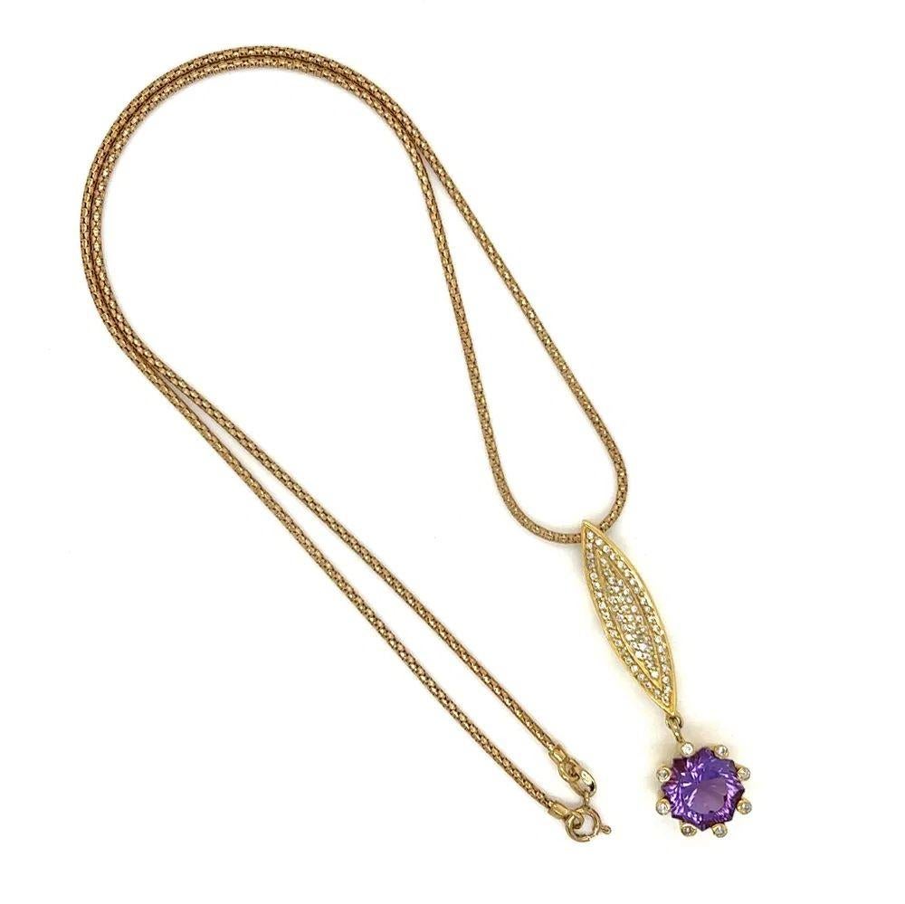 Simply Beautiful! Finely detailed Fancy Cut Amethyst and Diamond Gold Vintage Pendant Necklace. Featuring a securely Hand set 2 Carat Pear Amethyst. Dangling from a Medallion of 73 Pave set Sparkling Diamonds, weighing approx. 0.50tcw. Hand crafted