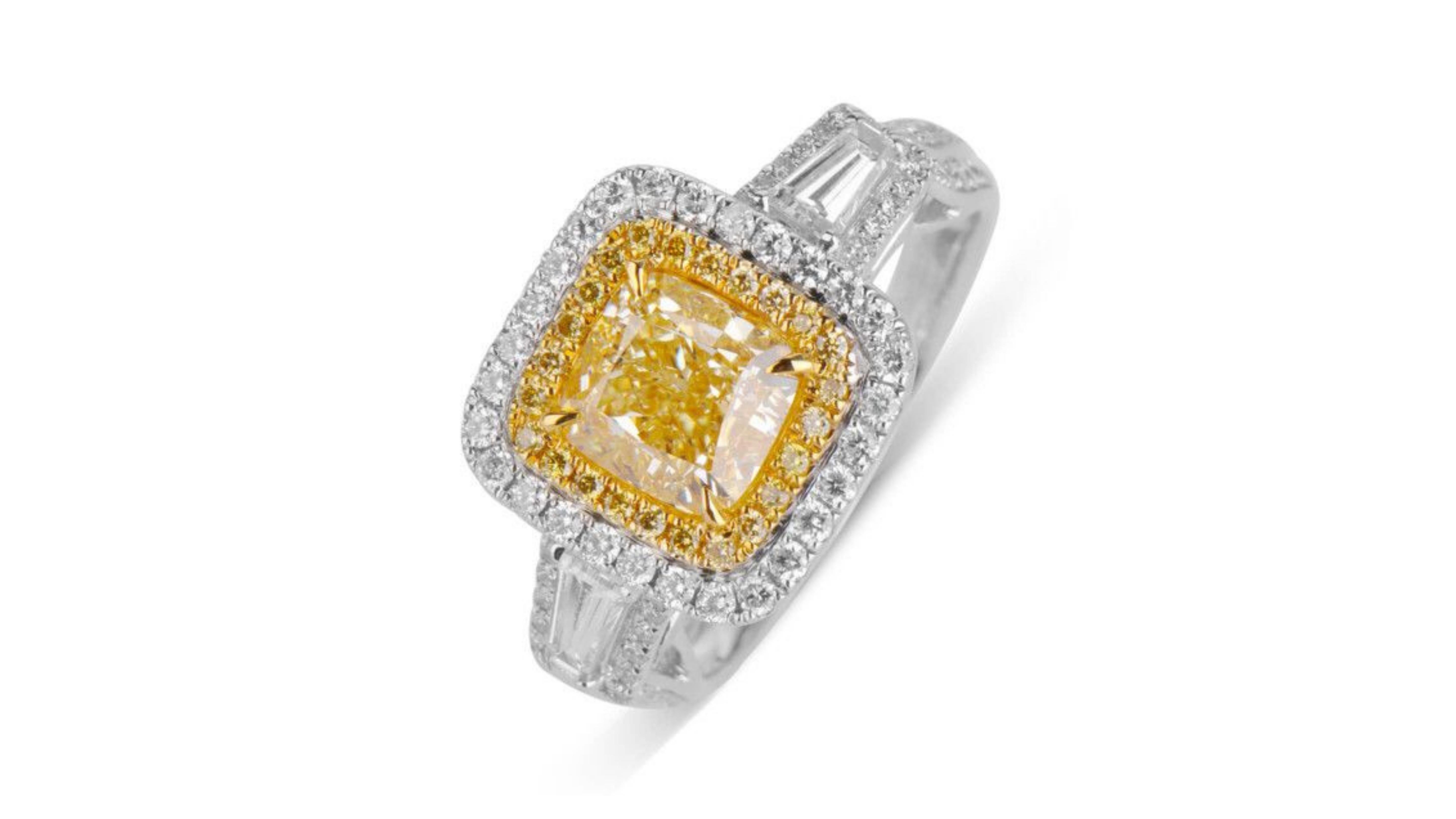 
This is a rare and unique 2 carat Fancy Yellow diamond Diamond Ring  Surrounded by 24 Brilliant Fancy Yellow Diamonds . Its  VS2  Clarity so any inclusions are not really noticeable.  Comes with a GIA Certificate   If you are looking for anything