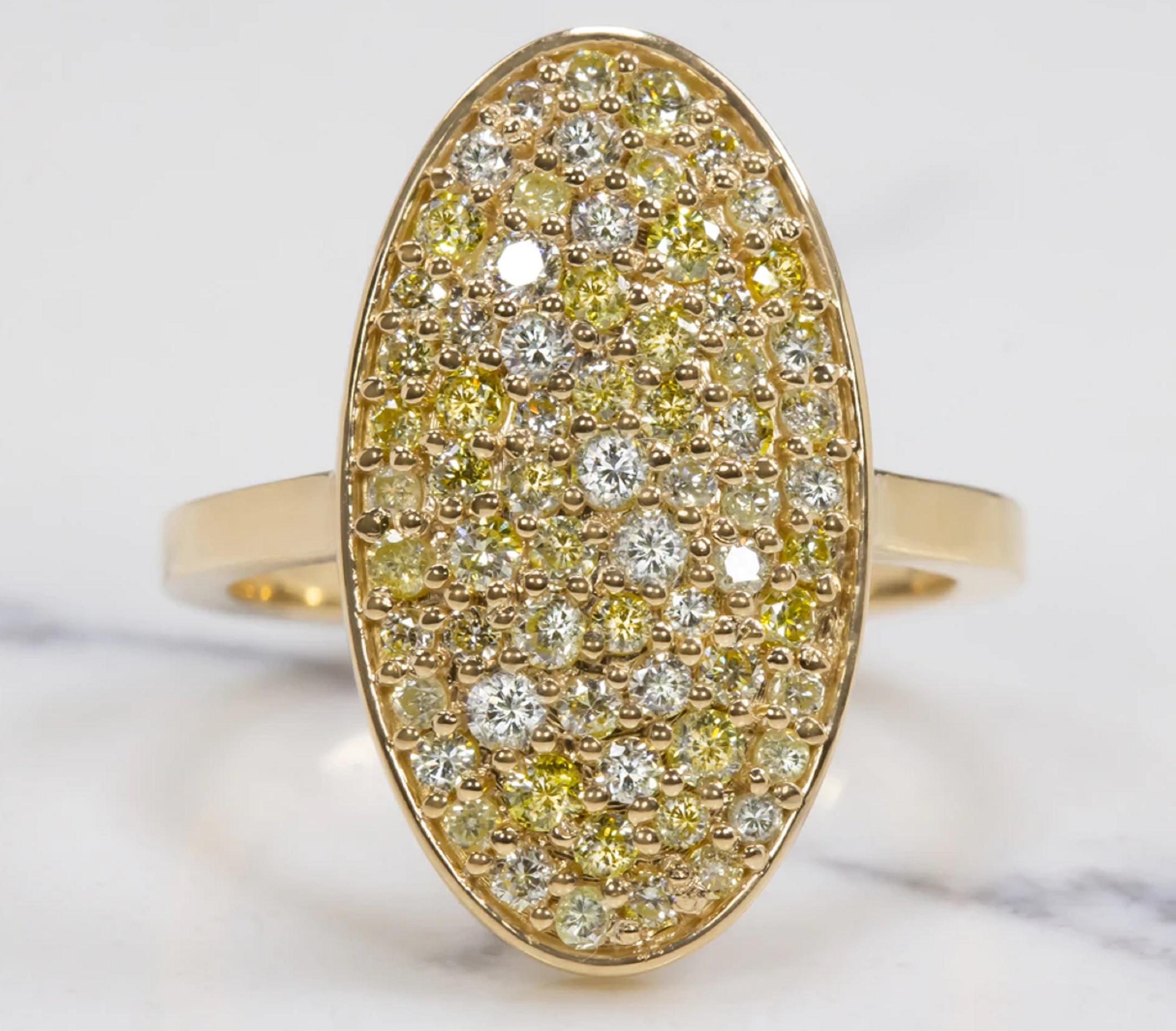 Amazing ring designed with 2 carats of yellow and white diamonds arranged in a beautifully varied display! Ranging in color from a bright white, to a buttery hue, to a bright canary, the vibrant diamonds were carefully selected to create a gorgeous,
