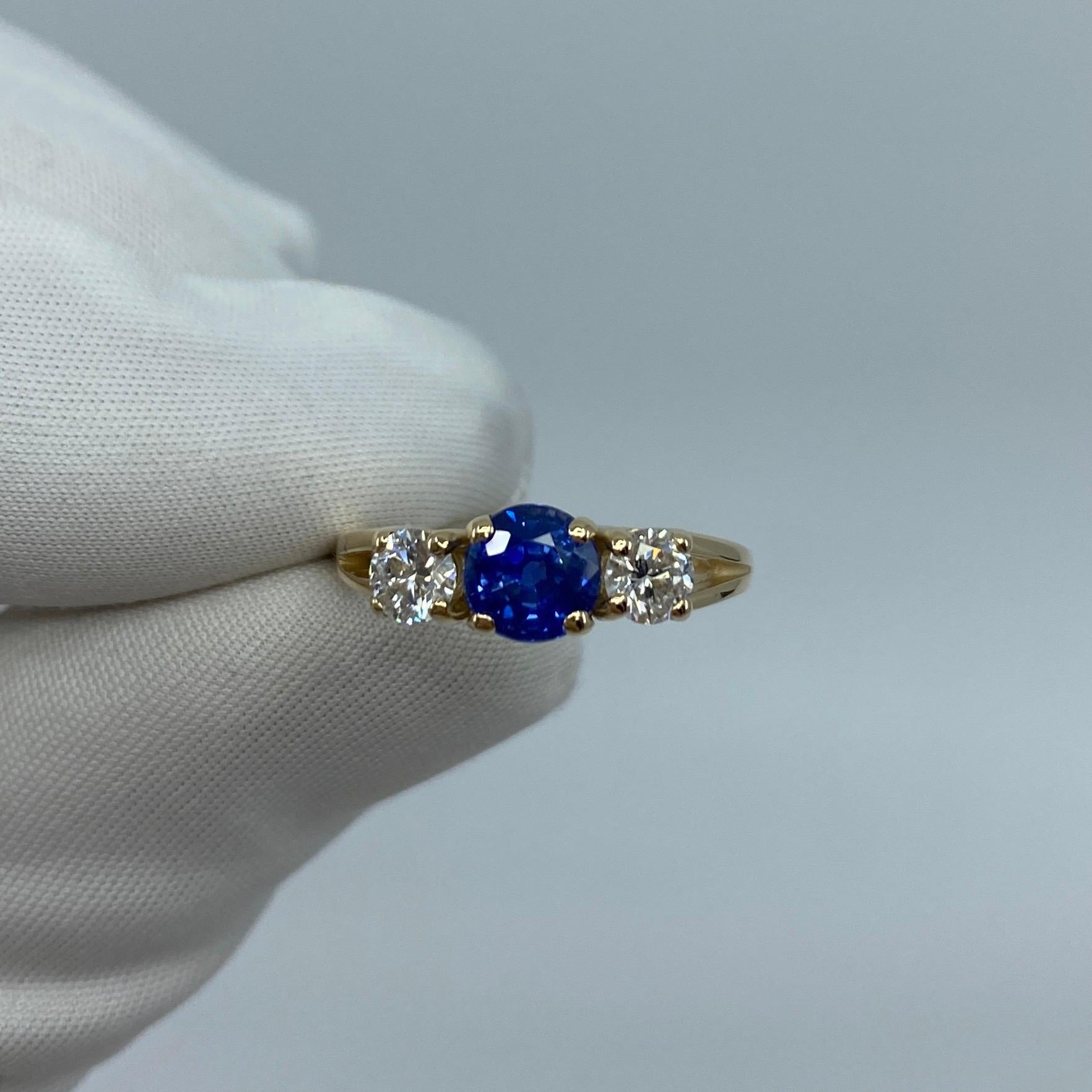 Fine Vivid Cornflower Blue Ceylon Sapphire & Diamond 14k Yellow Gold Three Stone Ring.

1.50 Carat centre sapphire with a fine quality vivid cornflower blue colour and very good clarity, a very clean stone with only some small natural inclusions