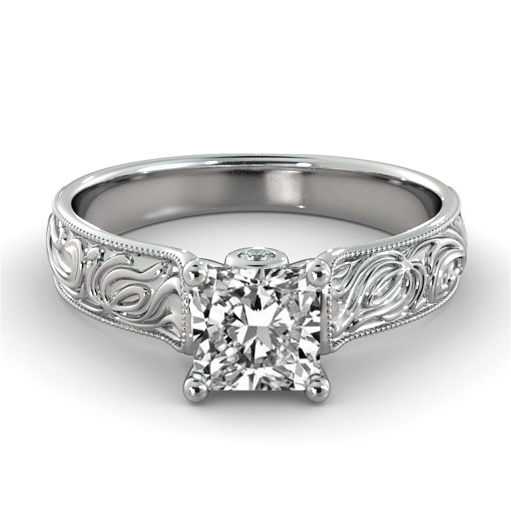 This breathtaking hand engraved vintage style ring features a solitaire GIA certified diamond. Ring features a 2 carat princess cut 100% eye clean natural diamond of F-G color and VS2-SI1 clarity accompanied by 2 smaller natural diamonds off approx.