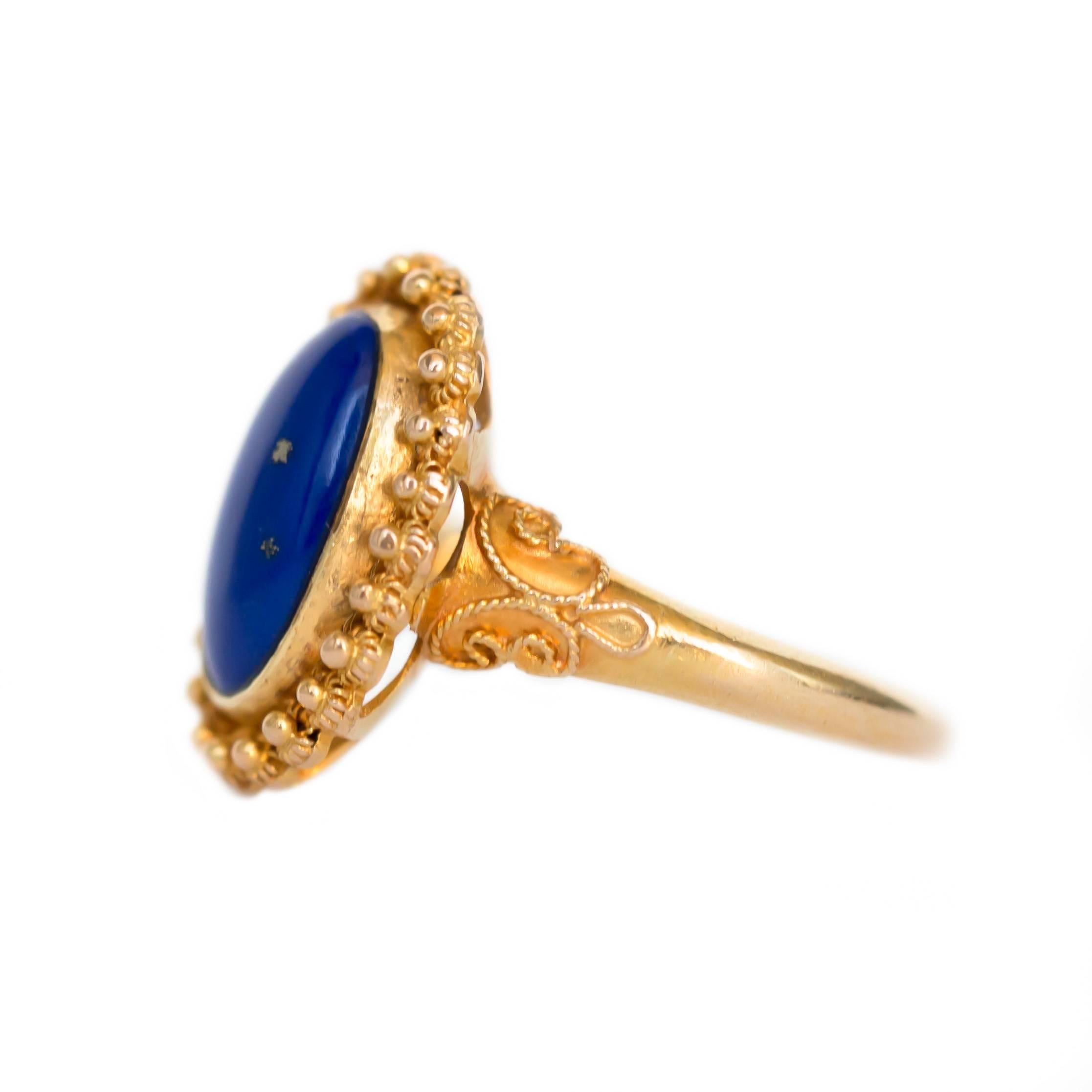 Item Details: 
Ring Size: 4.5
Metal Type: 18 Karat Yellow Gold
Weight: 3.9 grams

Color Stone Details: 
Type: Lapis Lazuli
Shape: Oval
Carat Weight: 2 carat
Color: Royal Blue

Finger to Top of Stone Measurement: 6.05mm