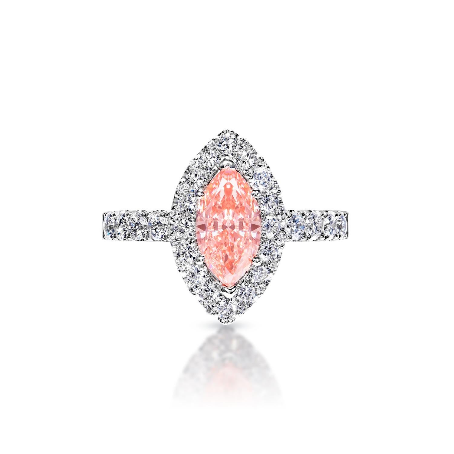 Adorn yourself with this truly stunning and unique GIA Certified diamond set. Featuring an eye-catching Fancy Vivid Pink* Marquise Cut center stone, along with a Round Brilliant cut side stone for beautiful contrast, the total carat weight of 1.67
